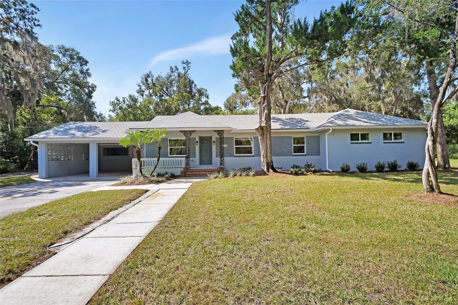 Looking for Space at an affordable price? This Classic 1950's home is ready for your family. Located on the Eastside of Deland, it is just minutes to I-4 and Highway 92, and just 20 minutes to I-95. The home has been completely remodeled from the ground up. From the moment you walk into the spacious formal living room, you will see and feel the quality of the workmanship with the transformation of this home. There is Luxury Vinyl Planking (LVP) throughout the home. From the Living Room you will walk into the heart of this large family home, a very open kitchen and dining room. Kitchen features a large island for family enjoyment with a custom stone wall set up for your flat screen TV for watching all your favorite shows. While prepping meals, one will love the Quartz countertops, stainless steel appliances and the beautiful views of the backyard. Just off the kitchen, you will find an oversized utility room with cabinets and butcher block countertop. In addition, there is an office area, these rooms have two entrance doors, one which opens to a quaint back porch overlooking the backyard. On the Bedroom side of this home, there are 3 normal bedrooms with closets and ceiling fans. The amazing bonus is, this home is set up with two Primary Suites, both with large rooms, closets, walk in tile showers, glass enclosures, tall vanities and double sinks. One of the primary suites also features a bonus room with amazing backyard views. The whole family will enjoy the wood patio with access from the Kitchen and one of the primary bedrooms. There is also a beautiful 3rd bathroom with large tile shower / glass shower doors. Part of this properties transformation is the custom landscape, all with new irrigation system to maintain the beauty. From the back porch, follow the winding sidewalk to the detached building which offers for ample storage for work or play vehicles. One area could be an apartment / In-law suite, it had once been set up as an apartment. This building has a concrete floor, water and electric. The home has all new: Electric, Plumbing, Roof, Septic Tank and Drain field, Drywall, Exterior & Interior Doors, Windows, Insulation, light fixtures, and Plumbing Fixtures. Most everything has been touched in this remodel. DeLand Florida features an Award Winning Mainstreet, great restaurants, and the Famous ST. Johns River.