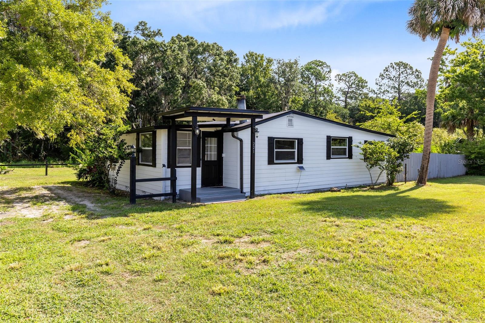Welcome to 421 Main St in charming Enterprise! This energy efficient & beautifully renovated 3-bedroom, 1.5-bath home sits on a spacious 0.4-acre corner lot, just minutes from I-4, Publix, and the scenic St. Johns River. The perfect blend of comfort, functionality, and location!
This home has undergone a complete remodel with impressive upgrades:
New roof in (2022). Spray foam insulation in walls and in ceiling. HVAC2022, plumbing 2022, and electrical panel (2022) Granite kitchen counters & fully remodeled kitchen. Double-pane windows, luxury vinyl plank floors, new 3/4inch treated wood subflooring & new doors in (2022) Updated bathroom and half bath — ideal for guests or a second bedroom suite. New septic tank and drain field in (2024)
Enjoy Florida living to the fullest with:
Screened lanai perfect for relaxing. Large storage shed with washer/dryer hookups & an additional smaller shed. Carport and tons of parking for your RV, boat, food truck, commercial vehicle, or toys. A generous fenced backyard great for privacy, entertaining, grilling, gardening, or pets! Whether you're looking for your primary home, vacation spot, or even a potential investment with flexible use, this property checks all the boxes. Don’t miss this opportunity to own a versatile, energy-efficient, move-in-ready home near everything in Central Florida and Volusia County beaches. Buyer to verify measurements.