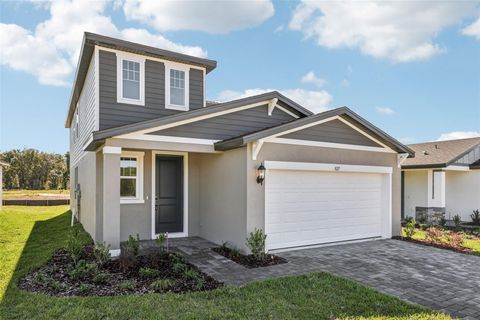 Photo of 827 Sunshower Drive, Lady Lake, FL 32159 (MLS # O6356655)