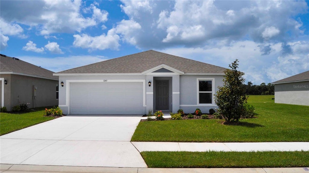 Photo of 12411 Hopscotch Avenue E, Palmetto, FL 34221 (MLS # A4694092)
