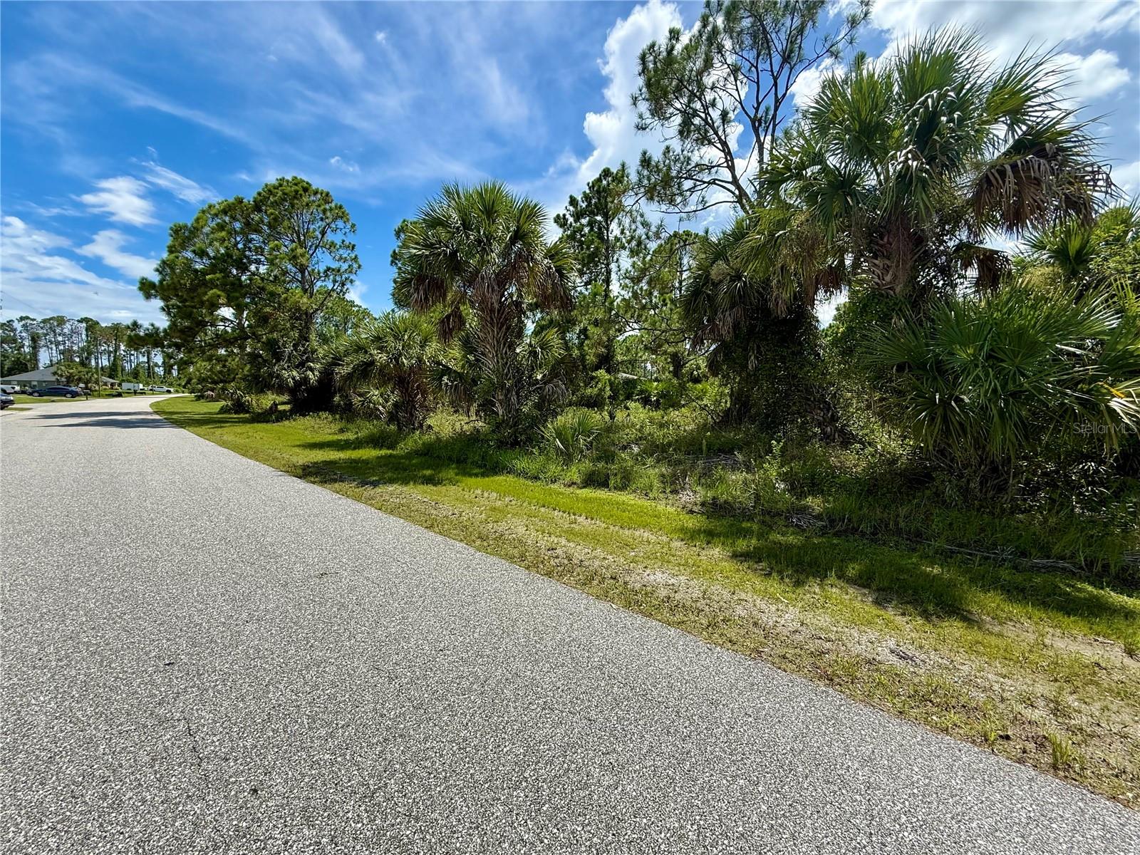 Looking for that perfect piece of land to build your slice of paradise on? Here's a great lot in this up-and-coming area of North Port! NO flood insurance required, save money and build with confidence!!! Electric nearby, and no need to worry about mitigating Scrub Jays as property is NOT located in a habitat. Bring all your toys...store your RV, boat, kayaks, put up a detached garage, shed for an art studio, trampoline, or treehouse, doesn't matter as this is a non-deed restricted area of Sarasota County! And of course, what could be more Florida than having your own pool which the property has plenty of room for! Property is close to all amenities including sandy beaches & crystal waters of Venice, Englewood & Boca Grande Beaches, Golf Courses, boat launches, minutes from TWO Spring training Stadiums, the Rays & the Braves who hosts games against the Yankees, Red Sox, Mets & more. Have local builder with floorplans of 3 bedroom 2 bathroom homes with 10’ ceilings, 8’ doors porcelain plank flooring throughout, Quartz/Granite, lighting & fans, appliances, Impact windows…all-inclusive pricing starting at $320,000.