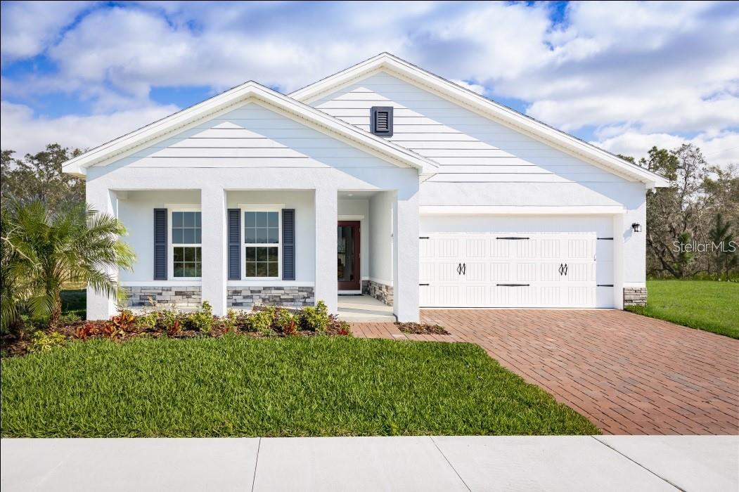 Pre-Construction. To be built. Discover your dream home at Lakeside Preserve. Conveniently located near I-4 and SR-570, commuting to Tampa or Orlando is a breeze. Plus, just across the street, you'll find Lakeside Village with a variety of shops and dining options like Cold Stone Creamery, Books-a-Million, Kohl's, Burger 21, and more. Imagine living in a beautiful, gated community with stunning homes and fantastic amenities. Dive into our refreshing pool, relax in the cabana, or take a stroll on our scenic walking trails. There's something for everyone at Lakeside Preserve! The Mahogany single-family home offers a fresh take on fine living. From your covered front porch or 2-car garage, step into a ranch floor plan that blends convenience and style. There’s plenty of room for family and friends in 2 spacious bedrooms, with a full bath just outside their doors. Gather in the great room for movie nights, and don’t forget to prep popcorn and other delicious snacks on the gourmet kitchen’s large island. Enjoy the night air on your lanai before heading to bed in the sensational owner’s suite, featuring a walk-in closet and step-in shower. The good life lives here. All Ryan Homes now include WIFI-enabled garage opener and Ecobee thermostat. **Closing cost assistance is available with use of Builder’s affiliated lender**. DISCLAIMER: Prices, financing, promotion, and offers subject to change without notice. Offer valid on new sales only. See Community Sales and Marketing Representative for details. Promotions cannot be combined with any other offer. All uploaded photos are stock photos of this floor plan. Actual home may differ from photos.