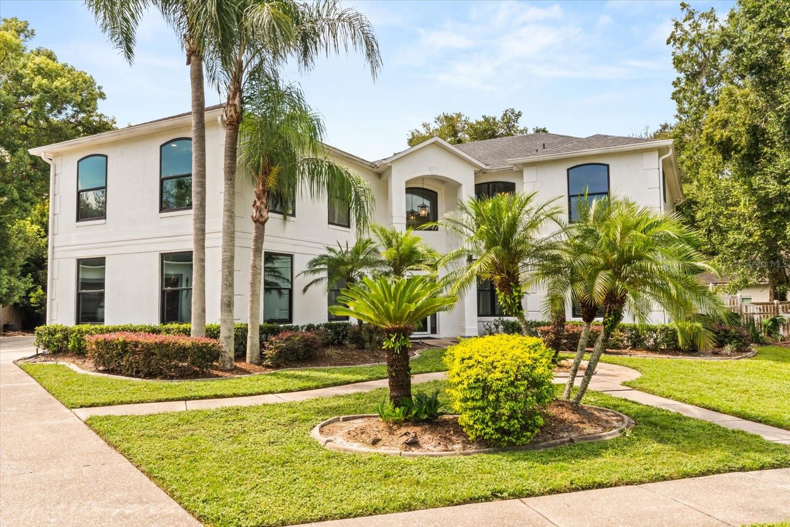 Welcome to your dream home in the friendly community of Wellington in Maitland. This impressive 4-bedroom, 3-bathroom residence spans 3,853 square feet and sits on a spacious 0.34-acre lot, perfect for family gatherings and entertaining. Step inside to discover an open layout filled with natural light. High ceilings and porcelain tile floors create an inviting atmosphere. The heart of the home, a gourmet kitchen, is equipped with stainless steel KitchenAid appliances, granite countertops, and a breakfast bar for casual dining. You'll love the convenience of two large pantries for all your cooking needs. The cozy family room has a beautiful fireplace and is open to the kitchen. The downstairs also includes a bedroom and bathroom perfect for in laws to stay the weekend! The upstairs includes the master suite, 2 additional bedrooms, another bathroom, a multi-function room perfect for movie night or workouts, and a well appointed laundry room. The master suite is a true retreat, showcasing a walk-in closet and a spa-like ensuite with a deep soaking tub and a spacious walk-in shower. It also features a large walk in closet, and an extra nook area for an office or nursery. Enjoy evenings on the sprawling patio, or cozy up by the fireplace indoors. Your outdoor oasis features a saltwater heated pool, a covered entertainment area, and a fire pit for memorable nights under the stars. The lush yard provides plenty of space for gardening and outdoor activities. Located near Kewannee Park, enjoy nature trails, playgrounds, and more, all within a quick bike ride. The nearby downtown Winter Park offers delightful dining and shopping. With easy access to I-4 and local attractions, this home is perfectly positioned for convenience. This family-friendly property includes SMART home features, energy-efficient windows, solar panels, and ample parking for your boat or RV. Come see how this spacious home can elevate your lifestyle.