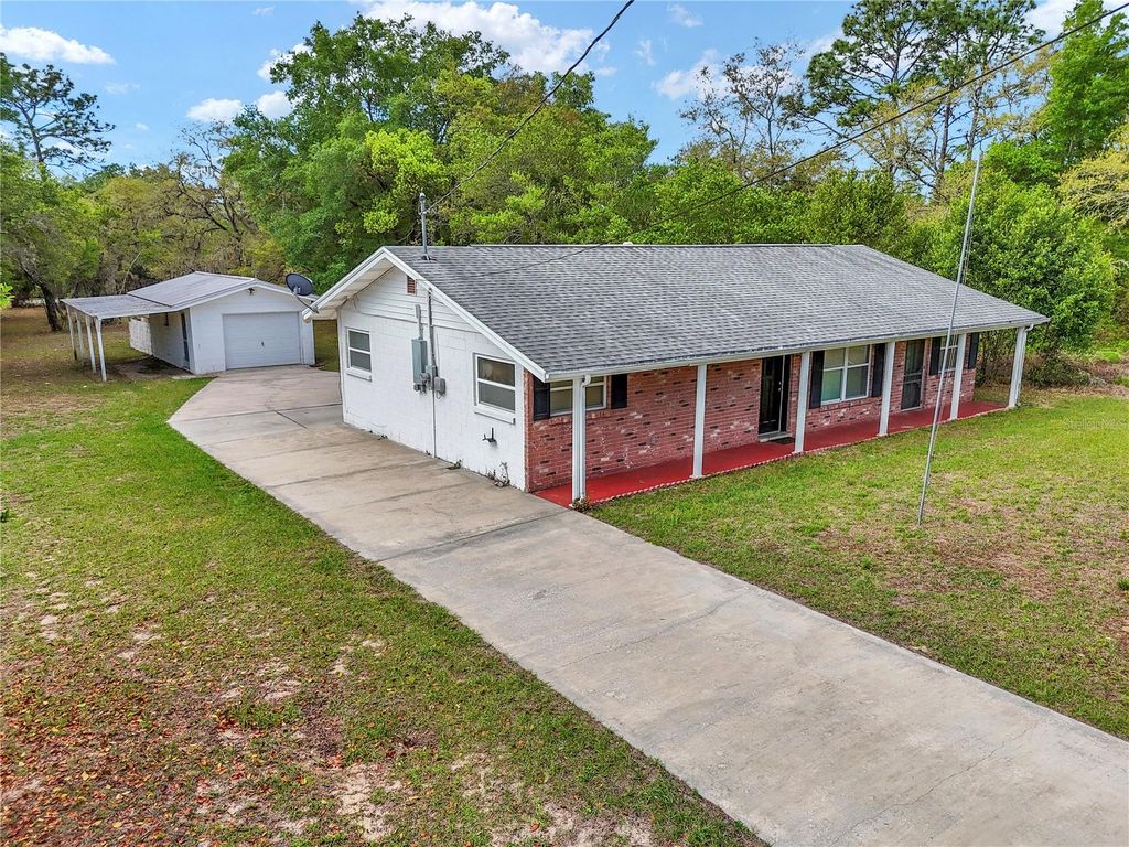 Photo of 21766 SW Rainbow Lakes Boulevard, Dunnellon, FL 34431 (MLS # OM722466)