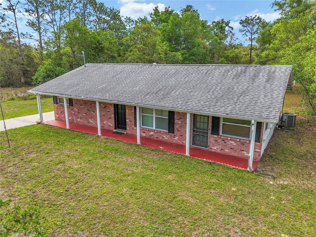 Photo of 21766 SW Rainbow Lakes Boulevard, Dunnellon, FL 34431 (MLS # OM722466)
