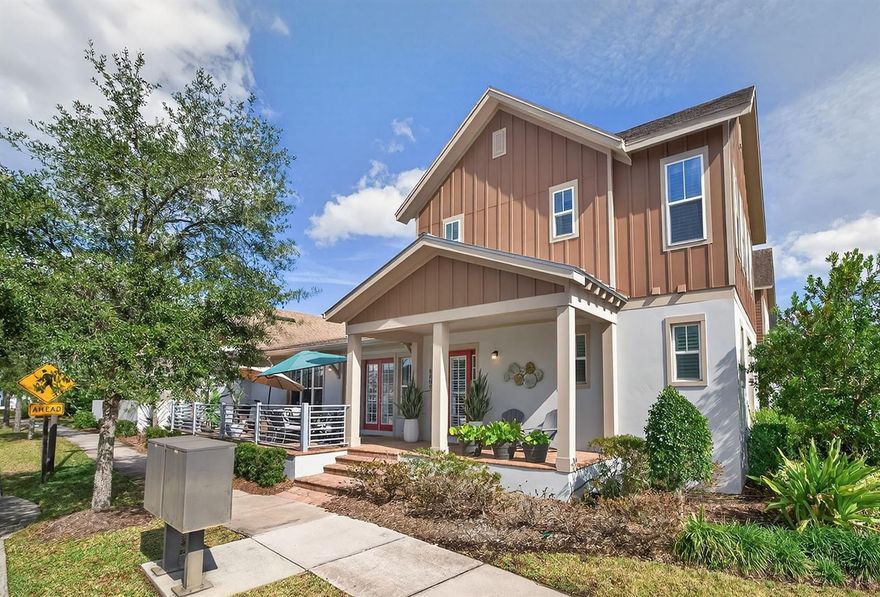 Rare to the market, this large end-unit Laureate Park townhouse looks brand new and offers so many great features. From the front steps, you’ll see the 38’ long side paver patio that’s a perfect outside space to wind down or grill-out. With over 2,000 interior sq ft, a wide open floorplan greets you with wood-look tile floors flowing through the spacious great room, dining area, and kitchen (a guest half bath is behind the staircase).  A wall of windows with custom wood shutters and a double set of French doors to the side patio makes the space light and bright. 
Quartz counter tops, breakfast bar, tile backsplash, upgraded cabinets, stainless steel appliances, and a huge walk-in pantry make this kitchen a dream for your home chef. A useful mudroom and separate laundry room lead to the oversized 2-car garage (there’s even extra parking in the large driveway). The FIRST FLOOR primary bedroom includes an expansive walk-in closet and ensuite bath with double sink, quartz vanity, private toilet room, and tiled walk-in shower. Upstairs off the loft (7’x9’) are two generous size guest bedrooms and a full bathroom with tub/shower combo. 
Laureate Park is more than just a neighborhood – it’s a lifestyle. HOA covers exterior, roof, ground maintenance, high-speed internet, resort style community pool/swim center, and fitness center. Publix is around the corner along with many restaurants and shops, and commuting is convenient with access to the 417 and 428.  Other amenities include: dog parks, walking trails, playgrounds, sport courts, tennis, and vibrant community events. Unbeatable location — minutes from Lake Nona Medical City, Boxi Park, USTA, KPMG, Orlando International Airport, and top-rated schools.