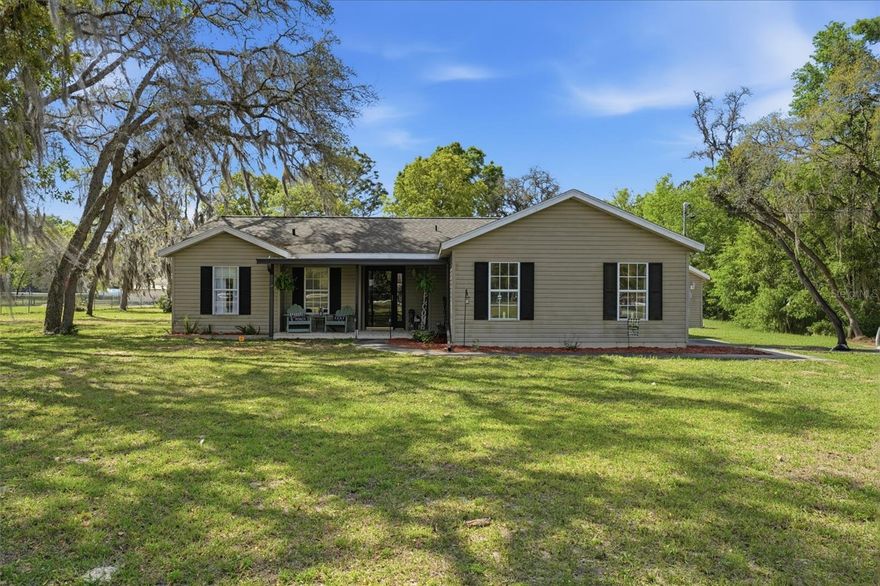 Welcome to peaceful country living in Rolling Hills, Dunnellon, FL! This charming 2-bedroom, 2-bath ranch-style home sits on a beautifully maintained 1.16-acre lot with NO HOA and NO restrictions, bring your RV, boats, and all your toys!  Step inside to find beautiful flooring, new cabinetry, and an updated kitchen featuring stone countertops and a spacious pantry. The home offers a bright, inviting layout with a Florida Room and sliding glass doors that open to your outdoor living space.  Outdoors, you'll find a true private retreat, featuring a saltwater pool, covered paved patio, and both front and rear covered areas ideal for relaxing or entertaining. The property is fully fenced with mature trees, fruit trees, and raised garden beds, creating a peaceful, park-like setting.  Step outside to your own private oasis with a sparkling pool, plenty of room to entertain, and wide-open space.  For those needing space to work or store equipment, this property delivers with a 30x25 workshop with 100-amp service, RV garage, attached garage, and a studio outbuilding completely finished with heat and air, great for guests, hobbies, or a home office or music studio. A shed provides additional storage.  Recent updates include a new HVAC system, new water heater, water softener, and septic recently pumped for added peace of mind. Additional features include well and septic, underground utilities, and a newer roof.  With room to roam, peaceful views, and multiple living areas, this one-of-a-kind property offers endless possibilities. No HOA, plenty of space, and true Florida living at its best. There is fishing available at Tiger Lake located with Rainbow Lakes Estate, 20 minutes from World Equestrian Center, 40 minutes from Gainesville, 30 minutes from Crystal River and the Gulf of America. Close to the Goethe National Forest for horse trail riding and nature walks. Set up your private tour of this lovely home today!