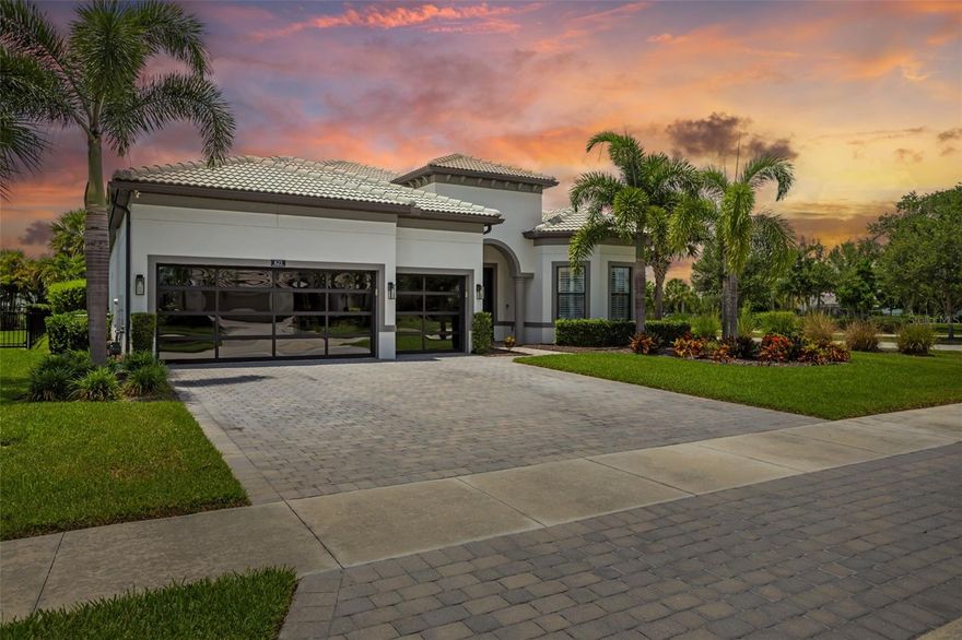 Luxury meets lifestyle in Shoreview at Waterside. This move-in ready home showcases over $180,000 in premium upgrades with soaring 12-foot ceilings, designer finishes, and an open-concept layout built for effortless entertaining. Featuring 3 bedrooms, 3 bathrooms, a private office, and a spacious 3-car garage, every detail was thoughtfully designed to blend elegance and comfort. Upgrades include hurricane-rated modern glass front and garage doors, upgraded flooring, custom built-in closet shelving, attic decking for additional storage, fresh exterior paint, and enhanced landscaping. Step outside to your private backyard retreat complete with a putting green, outdoor kitchen with pergola and mini fridges, new pavers, and a fully fenced yard designed for year-round Florida living. Located just minutes from Waterside Place, enjoy easy access to waterfront dining, local shopping, weekend farmers markets, and entertainment all just a golf cart ride away. Luxury living without the wait of new construction.