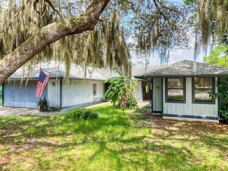 INVESTMENT OPPORTUNITY ALERT!!! This 2/2 Pool home is being sold AS-IS and if you’re a savvy Buyer, with an eye for a diamond in the ruff, you don’t want to miss out on this project! Sitting atop a large double Lot that boasts plenty of room for storing all your toys including a 2-car garage w/laundry area, a separate covered steel garage, ideal for RV/Boat or ATV’s and a little shed which could serve as man-cave/she-shed. One of its most attractive features of this home is its large covered patio area w/screened in pool.  One day, this space will make a peaceful oasis and a lovely place to entertain or just relax. The interior offers the new owner a unique layout with plenty of room to reimagine every space.  With some TLC, this home really does have tons of potential. ;Water: City