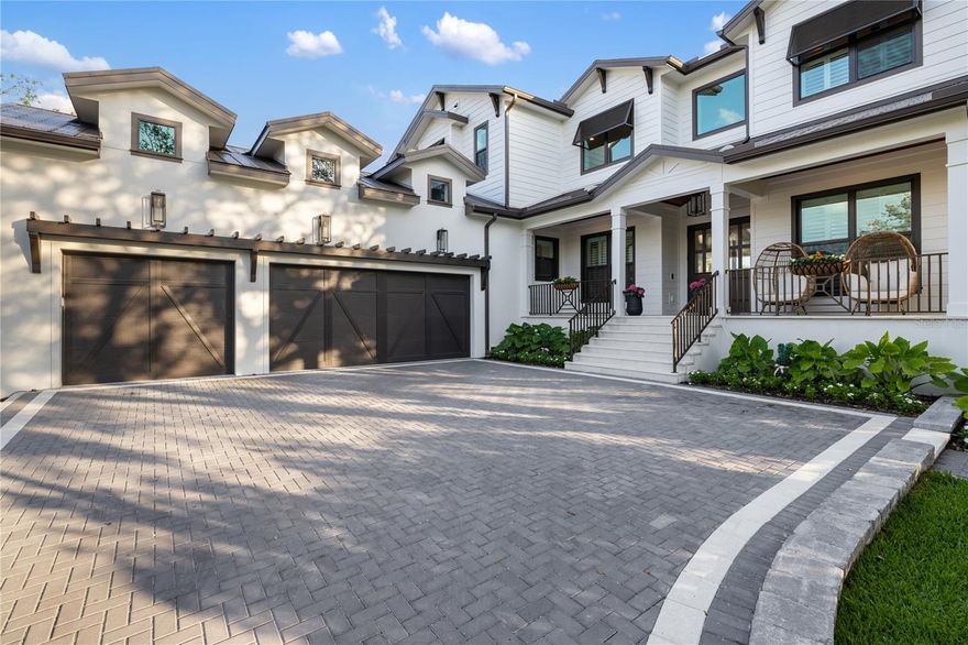 Start living your dream lifestyle on world-famous Siesta Key in this Pham Development custom-built waterfront British West Indies–style home. Located on a quiet street on the north end of the key—close to the beach, Siesta Key Village and Out-of-Door Academy—and just minutes on and off the island, this residence offers island living at its best. Set on a corner canal-front lot, the two-story home features 5 bedrooms, 5 full bathrooms and 1 half bath, with 3,875 square feet under air, a great room floor plan, soaring 22-foot vaulted ceilings, and walls of windows and doors—including large pocket sliders—that bring in abundant natural light and seamlessly connect indoor and outdoor living.