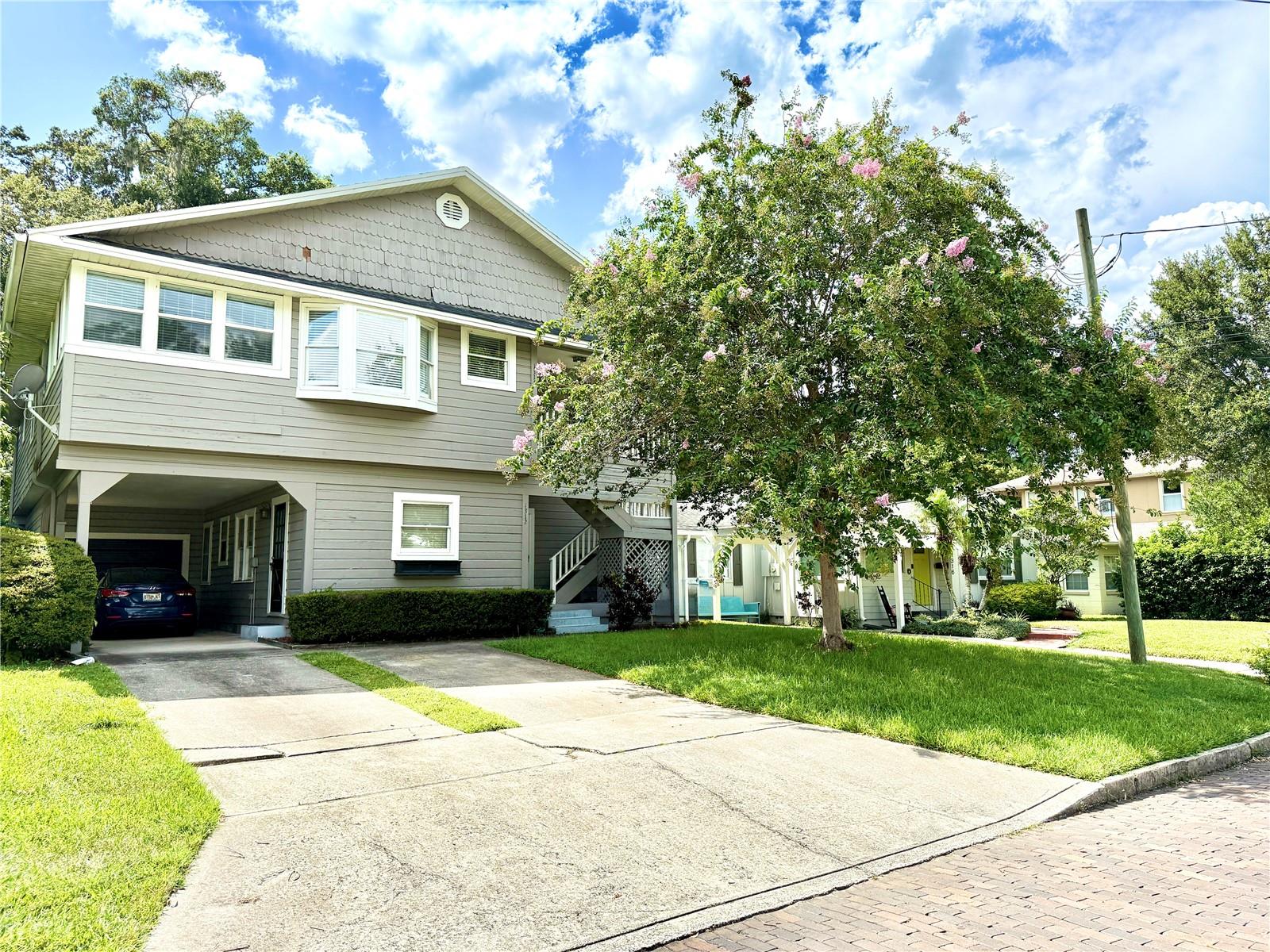 A Fantastic Income-Producing Opportunity in One of Orlando’s Most Vibrant and Central Neighborhoods. This Spacious Two-Story Property Features 5 Bedrooms and 3 Bathrooms (2 Bed/1 Bath Downstairs and 3 Bed/2 Bath Upstairs) a One Car Garage and a Carport. Perfect for Investors or Multi-Generational Living. The Home is Currently Split into Two Units: The Downstairs Unit is Tenant-Occupied with Long-Term Stability, while the Upstairs Unit is Currently Vacant and Ready for Occupancy or Additional Rental Income. The Downstairs Tenant has been in Place for 8 Years, Paying $1,500/month with a Current Lease Running Through 12/31/2025. The Upstairs Unit is Larger and can be Rented for $3,000 per month. Tenant is Responsible For Utilities (Electric and Water) and Internet/Cable. The Upstairs Unit Offers Great Potential for Owner-Use or to Generate Additional Income in this High-Demand Area. The Property Boasts Excellent Curb Appeal, a Beautifully Landscaped Front Yard and a Bright, Open-Concept Interior. Inside You’ll Find a Spacious Living Room, Modern Kitchen with Stainless Steel Appliances and Large Bedrooms Including a Primary Suite with Private Bathroom. The Backyard Offers a Peaceful Patio—Ideal for Relaxing or Entertaining. A Brand-New Roof is Being Installed and will be Completed by approximately 9/1/25, Providing Added Value and Peace Of Mind! Located Minutes from Downtown Orlando, Shops, Restaurants, Parks and Major Highways, This Property Combines Urban Convenience with Long-Term Investment Potential. Don’t Miss This Income Property in a Prime Orlando Location!
