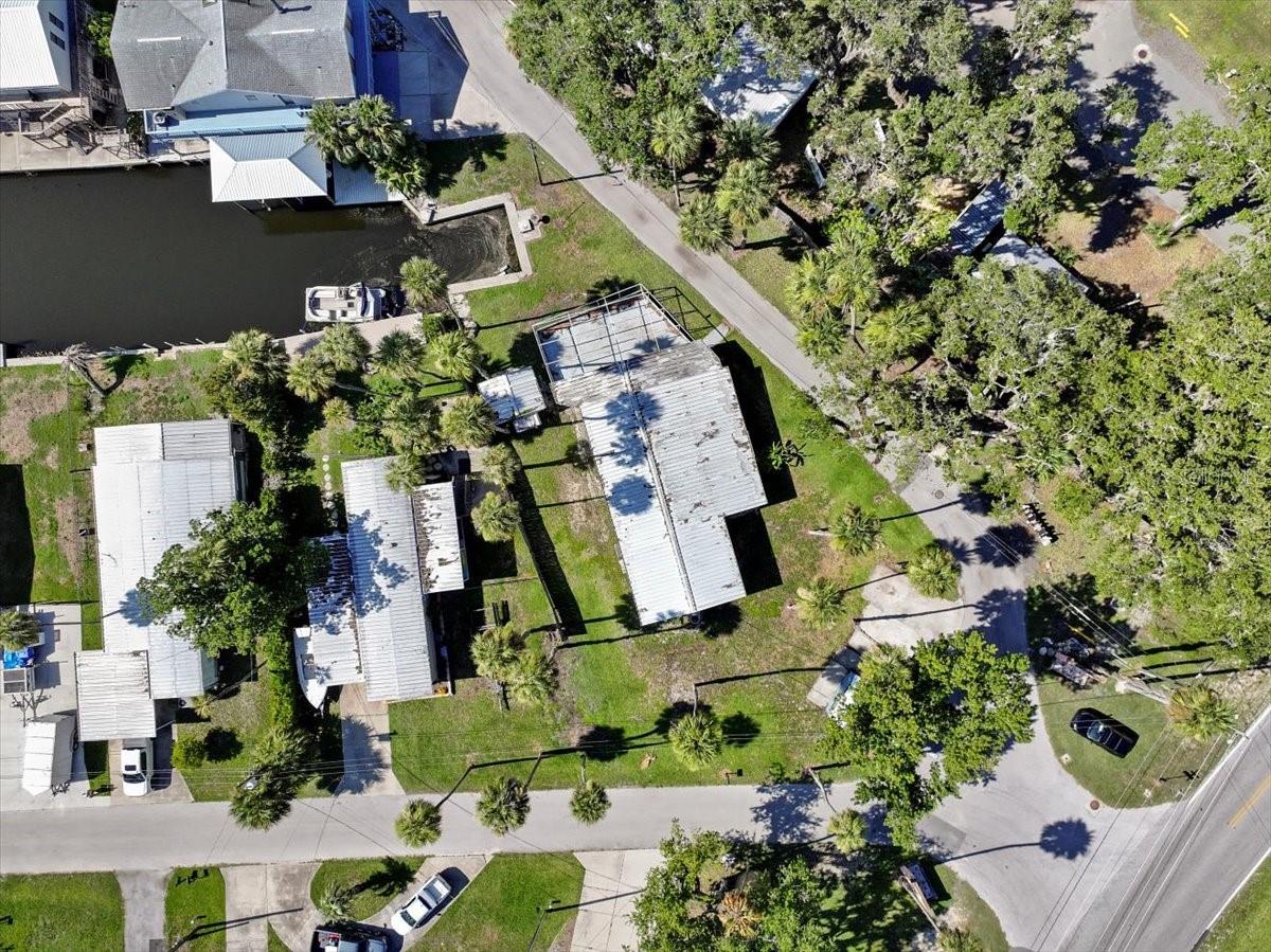 This oversized 0.26 acre waterfront lot in the highly desired Twin River Lane Estates subdivision, is your chance to create the ultimate riverfront retreat in one of Florida’s most charming coastal towns. Located on a direct channel off the Homosassa River that leads to the Gulf and the Halls River, the property includes its own private boat slip and deeded boat ramp, offering quick and easy access to boating, fishing, kayaking, and more. The current mobile home on the property must be brought up to code compliance and has previous flood damage from the previous storm, making this an ideal opportunity to start fresh. With plenty of room to build, and unbeatable water access, this lot is ready for your dream design. Just a short ride to Crump’s Landing, Seagrass Waterfront Grill, Florida Cracker Riverside Resort, and Homosassa Springs State Park, this location gives you the best of nature, nightlife, and everything in between. Bring your vision, your builder, and your boat, this Homosassa lot is ready to be reimagined into something truly special for your forever home.