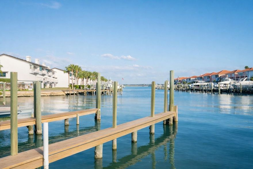DEEDED BOAT SLIP included with the sale! REMODELED. New AC. *** Experience refined coastal living in this beautifully updated waterfront residence overlooking the marina—complete with the rare luxury of your own private boat slip. Spacious and move-in ready, the condo blends comfort, style, and effortless beachside living in a setting designed for both relaxation and entertaining. *** 

Inside, a thoughtfully renovated kitchen showcases elegant shaker-style cabinetry, sleek stainless-steel appliances, and a clean, contemporary aesthetic that flows seamlessly into the open living and dining areas. The airy layout is ideal for hosting guests or simply enjoying the tranquil marina views. Fresh interior paint and timeless matte accents throughout create a polished, modern atmosphere, while a brand-new A/C system ensures year-round comfort after long days spent enjoying the coast. *** 

The primary suite offers a peaceful retreat, featuring a private balcony, generous closet space, and an ensuite bathroom. A second bedroom, overlooking the shimmering intracoastal waters, provides flexibility as a guest suite or inspiring home office. An additional full bathroom with a spacious vanity and walk-in shower adds convenience for visitors. *** 

Parking is effortless with an assigned covered space, along with additional guest parking available within the community. Pet owners will appreciate that the residence welcomes two small companions. *** 

Residents enjoy a host of resort-style amenities, including a heated waterfront pool surrounded by tiki huts, a fishing pier, outdoor poolside shower, kayak and bicycle racks, a convenient car-wash station, and a secure lobby entrance with surveillance cameras. The community also features indoor mailboxes and ground-level restrooms for added convenience. *** 

Just across the street, pristine Gulf beaches await. From here, you can stroll, bike, or hop on the trolley to nearby dining, boutique shopping, tennis and pickleball courts, and lively waterfront restaurants and bars. *** 

Recent building updates provide additional peace of mind, including the completion of the milestone structural inspection, stucco repairs, balcony and walkway resurfacing with gemstone finishes, and a freshly painted exterior. *** 

Whether you envision a full-time coastal residence, a luxurious seasonal retreat, or a smart investment property, this exceptional waterfront condo delivers the very best of the Florida beach lifestyle. Schedule your private showing today.