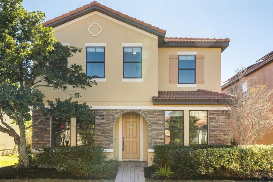 This beautifully refreshed two-story home in the gated Villages of Wesmere invites you to live comfortably and entertain effortlessly. Fresh interior and exterior paint, lush landscaping, and timeless barrel tile roofing set a polished first impression. Inside, the open layout flows seamlessly from the kitchen to the living and dining areas, creating a warm and welcoming space for everyday living. The kitchen features granite countertops, stainless steel appliances, and tall 42-inch cabinets, ideal for home chefs and family gatherings.

Upstairs, the spacious loft offers a flexible retreat for movie nights, study sessions, or playtime. The primary suite includes a walk-in closet, double vanity, soaking tub, and a glass shower, while four additional bedrooms provide room for everyone. The convenient upstairs laundry room keeps chores simple and stress-free.

Outside, enjoy a generous shared green space that feels like an extension of your own yard. The community adds even more appeal with a pool, clubhouse, playgrounds, and parks. Located near top-rated schools, major highways, and everyday conveniences like Publix, restaurants, and shopping, this home blends comfort, convenience, and community living in one inviting package.