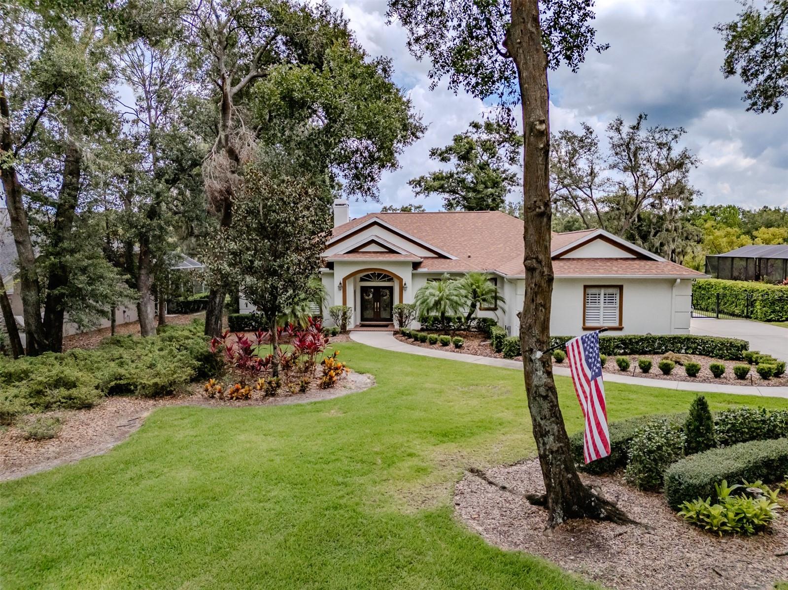 This 4 bedroom 3 bath home is located in the 24 hour guard/gated community of Fish Hawk Trails. As you enter this warm and cozy home you are greeted by the peaceful view of the beautiful backyard and conservation. The kitchen offers lots of cabinets, granite countertops, a work island, stainless steel appliances including a double oven, a desk area, and a closet pantry. The breakfast nook has glass sliders and is great for casual dining. The large dining room overlooks the front yard and is perfect for your holiday dinners. The open & airy family room boasts a wood burning fireplace with a mantle, remote shades for the triple glass sliders that lead to the lanai. The oversized primary suite offers a serene view and has plenty of room for a sitting area and the glass sliders open to the lanai. The En-suite offers his & her vanities, a soaking tub, a walk-in shower and a walk -in closet. The secondary rooms are spacious and located on the opposite side of the home. The large, extended screen enclosed, brickpaverd lanai overlooks conservation and has an outdoor kitchen with an abundant amount of room to entertain. The fenced in backyard has a shed with electric and a roll up garage door and has plenty of room to build a pool and for the dogs to play. The AC is brand new and the roof is one year old. There are Plantation shutters & crown moulding throughout, a plug in for a generator in the garage and a well for irrigation that is sure to save money on your water bill. You will enjoy your privacy as there are no backyard neighbors and you are surrounded by nature. This house is situated on a 1/2 acre lot and offers great curb appeal with the 3-car side entry garage, the double leaded glass front doors, the mature trees and the lushly landscaped, manicured yard. There are miles of walking trails, tennis, basketball and pickleball courts, soccor and baseball fields & a community center to enjoy. But the best thing is the nature Fish Hawk Trails has to offer... you can be greeted at any time with deer munching on side of the road. You have country Living with city convenience . Located minutes to shopping, dining and schools. Fish Hawk Trails is surrounded by some of the top schools in the county.