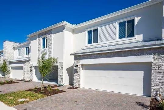 One or more photo(s) has been virtually staged. Discover the perfect blend of modern style and functional design in this beautiful and spacious 4-bedroom, 3.5-bath townhome located in the desirable Champions Pointe community in ChampionsGate, FL. The open-concept layout seamlessly offers the style, comfort, and flow you’ve been looking for, connecting the great room, kitchen, and dining area—ideal for everyday living and entertaining.  The property was built in 2023 and still looks brand new.  Many components are still under the builder's original warranty.
The kitchen features a sleek, contemporary design with generous counter space and a natural flow into the main living areas. Sliding doors open to a patio, providing a comfortable space for relaxing or hosting guests outdoors.
Upstairs, all four bedrooms are thoughtfully arranged for privacy and convenience. The spacious owner’s suite includes a walk-in closet and a spa-inspired ensuite bathroom, offering a peaceful retreat at the end of the day.
Champions Pointe is a master-planned community perfectly situated near world-class recreation and entertainment. Enjoy quick access to I-4, FL-429, and US-27, placing you within a 20-minute drive of Walt Disney World Resort and all the excitement Central Florida has to offer.