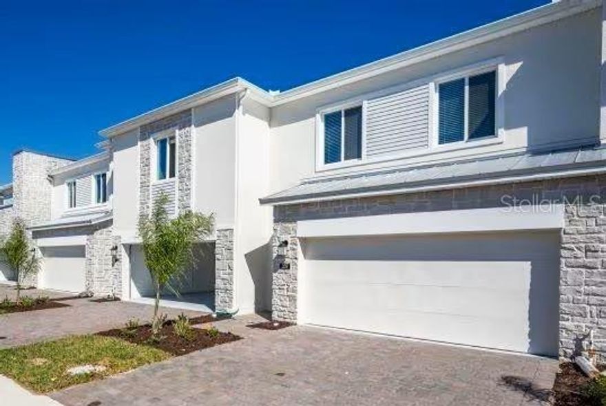 One or more photo(s) has been virtually staged. Discover the perfect blend of modern style and functional design in this beautiful and spacious 4-bedroom, 3.5-bath townhome located in the desirable Champions Pointe community in ChampionsGate, FL. The open-concept layout seamlessly offers the style, comfort, and flow you’ve been looking for, connecting the great room, kitchen, and dining area—ideal for everyday living and entertaining.  The property was built in 2023 and still looks brand new.  Many components are still under the builder's original warranty.
The kitchen features a sleek, contemporary design with generous counter space and a natural flow into the main living areas. Sliding doors open to a patio, providing a comfortable space for relaxing or hosting guests outdoors.
Upstairs, all four bedrooms are thoughtfully arranged for privacy and convenience. The spacious owner’s suite includes a walk-in closet and a spa-inspired ensuite bathroom, offering a peaceful retreat at the end of the day.
Champions Pointe is a master-planned community perfectly situated near world-class recreation and entertainment. Enjoy quick access to I-4, FL-429, and US-27, placing you within a 20-minute drive of Walt Disney World Resort and all the excitement Central Florida has to offer.