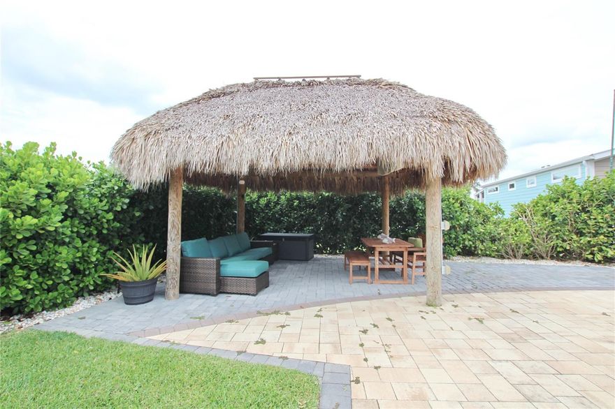 Located in the beautiful 5-Star Silver Palms RV Resort, extra large improved lot, prime location, 3500 square feet with easy access for any size rig, easy entry and plenty of room for parking.  Close to the beautiful bath house with laundry facilities.  Lot improvements include mature clusia hedges for ultimate privacy, St Augustine grass with automatic irrigation with timer and soaker lines for clusias, custom pavers, large river rock in perimeter of the lot, custom Tiki with pressure treated pine construction with added 3' bump outs, TV mounted with surround sound under the Tiki, outdoor ceiling fan with LED lights around the perimeter of the Tiki, power outlets on each Tiki pole.  Lawn fertilized quarterly; pest control monthly.  Plumbing and power stubs provided for future Casita. Location, Location, Location!!!!