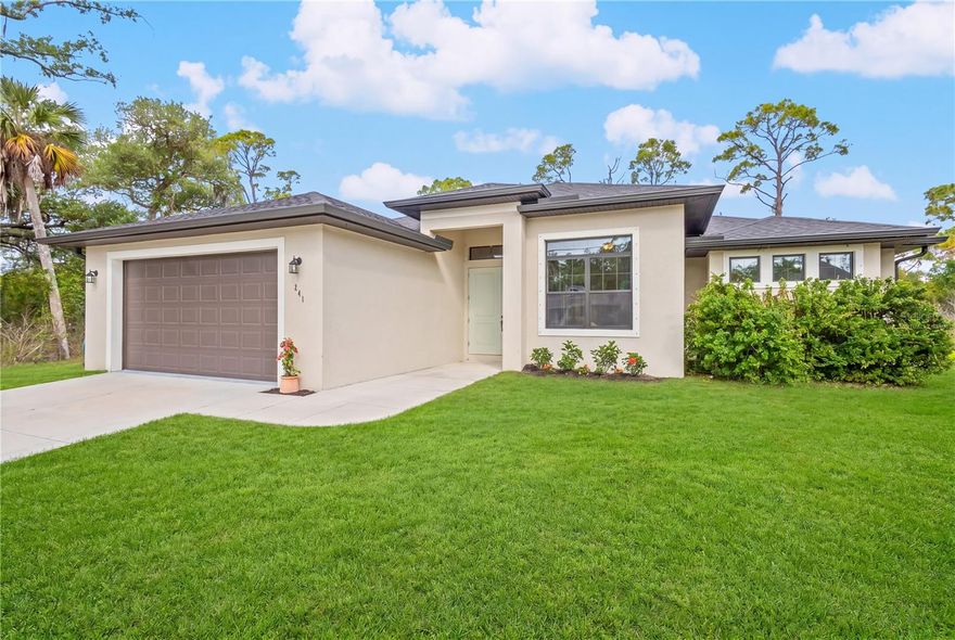 One or more photo(s) has been virtually staged. Step into modern Florida living with this beautifully designed 4-bedroom, 2-bath, 2-car garage home built in 2022, perfectly situated on a canal. This move-in-ready property blends contemporary style with everyday comfort, offering an open, airy layout ideal for both relaxing and entertaining.

The spacious open floor plan features a bright living area that flows seamlessly into the kitchen and dining spaces. The kitchen stands out with granite countertops, sleek cabinetry, and a functional layout that makes cooking and gathering effortless.

Enjoy peaceful water views from your enclosed lanai, the perfect spot for morning coffee, evening unwinding, or year-round indoor-outdoor living. The canal adds a serene backdrop and enhances the overall privacy and charm of the property. Enjoy effortless boating from the Apollo Waterway, where just one canal and two bridges stand between you and the river, offering quick, convenient access to the harbor and the Gulf.

With four well-appointed bedrooms, modern finishes throughout, and the benefits of newer construction, this home offers low-maintenance living and the best of the Florida lifestyle. Conveniently located near shopping, dining, parks, and Gulf Coast beaches, it’s an ideal choice for full-time residents, seasonal living, or investment.