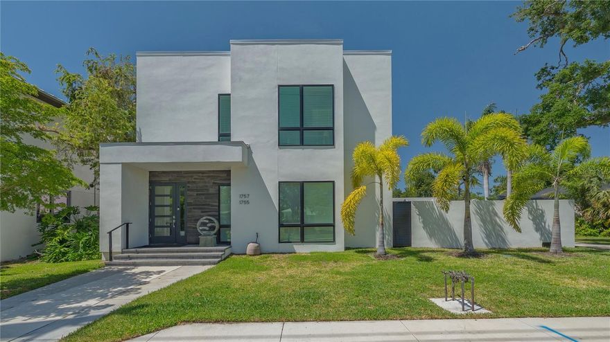 DOWNTOWN FAMILY COMPOUND OR INVESTMENT DUPLEX. TWO ADA-COMPLIANT RESIDENCES WITH THREE CAR GARAGE, ELEVATOR, SOLAR, PIPED NATURAL GAS. Welcome to one of Gillespie Park’s most extraordinary finds—a sleek, contemporary MULTI-GENERATION residence or INCOME PRODUCING INVESTMENT just steps from downtown Sarasota! This 2023 custom-built two-story home offers over 4,400 sq. ft. of luxurious living space, thoughtfully crafted for two households to live independently yet connected, or easily transformed into a spacious single-family retreat. • TWO 2200 SQ.FT. RESIDENCES: Each floor boasts a 2 bed / 2 bath ADA-compliant layout, soaring 10-ft ceilings, and abundant natural light with motorized blinds, downstairs surround sound. • Gourmet Kitchens: Downstairs: Thermador appliances, 6-burner gas cooktop, dual dishwashers, walk-in pantry, and a stylish coffee/wine bar, laundry room. Upstairs: Bosch appliances, laundry room, and two ensuite bedrooms.
• Outdoor Living: Ground Floor courtyard with outdoor kitchen, hot tub, and lush privacy walls. Expansive Second Floor Balcony is partially covered, perfect for relaxing or entertaining.
• Energy Smart: Natural Gas tankless hot water heaters. Solar panels currently power the second floor but can be switched to the ground level.
• Rare 3-Car Garage with rear alley access—one of the few blocks in Gillespie Park with this feature.
• Elevator + Wide Stairwell for seamless access between floors.
• Zoned for Short-Term Rentals – a golden opportunity for investors!
• Gillespie Park Amenities: Dog run, tennis courts, and a vibrant community vibe.
• Walkable Lifestyle: Minutes from the Rosemary Arts District, downtown dining, shopping, and theaters.