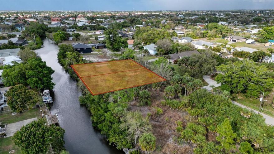 Great waterfront Double lot investment and building opportunity.  150 feet of waterfront ON QUIET STREET- not located in Punta Gorda City Limits therefore no deed restrictions, no HOA and no CDD fees but you get all the amenities of water front living in Punta Gorda! READY TO BUILD YOUR DREAM HOME - prime residential lot to build your dream home. BUILD AN OVERSIZED DOCK W/ COVERED BOAT LIFT! Nestled in the picturesque community of Punta Gorda, this spacious lot offers the perfect opportunity to design and build the home of your dreams. Located in a serene neighborhood with close proximity to all the amenities Southwest Florida has to explore this property is ideal for those seeking a peaceful yet convenient lifestyle. Rich waterfront recreational area from this location it is only a 20 minute ride to Charlotte Harbor, less than an hour to Boca Grande Pass and the Gulf of Mexico. Less than 3.5 miles to I-75 and only 4 miles to Punta Gorda Airport making this location an easy commute to almost anywhere, and only 4.5 miles to Ponce DeLeon Park with amazing sunsets, 10 miles to Port Charlotte Town Center and only 5 miles to Punta Gorda Historic district and waterfront park with historic downtown Punta Gorda, featuring charming shops, dining options, and vibrant entertainment. Tampa Bay Rays spring training and the fairgrounds are just minutes away, also multiple golf courses and some of the best boating and fishing in all of Florida. Red Soxs, Orioles, Twins and Braves spring training all within an hour’s drive. Conveniently located near major highways, making it easy to travel to nearby beaches, golf courses, and other attractions. This lot provides the ideal blank canvas to bring your vision to life in one of Florida's most sought-after areas. CALL TODAY.  DON’T MISS THIS ONE.