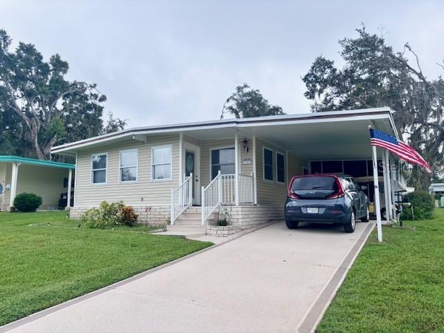 This lovely home sits at the end of a quiet cul-de-sac in the popular Hawthorne at Leesburg. Step inside to an open floor plan and a bright kitchen with a skylight and self-closing cabinets. Enjoy relaxing on the screened-in porch or take comfort in the recent updates, including new flooring and subfloors, updated plumbing, roof (2019), HVAC (2025), front windows, and refreshed siding and driveway. With great curb appeal, this move-in-ready home is ready for you to enjoy!.......Hawthorne at Leesburg is an active, resident owned, 55+ cooperative, waterfront, gated community, with beautifully landscaped grounds, lakes with illuminated fountains and a relaxing and comfortable gazebo. The affordable monthly maintenance fee of $346 includes water, sewer, lawn mowing, private emergency services and storage space for recreational vehicles, boats, trailers and much more! The beautiful clubhouse is complete with a full-time program coordinator, more than 100 different activities and seating for 550. It has a hospitality lounge, card rooms, craft rooms, billiard room, fitness center, library, fine arts room and many more. There is excellent fishing, outdoor geo-thermally heated pool and two enclosed therapeutic pools. Hawthorne boasts a private marina monitored by an electronic security system with over 120 boat slips and access to the Harris Chain of Lakes and beyond.