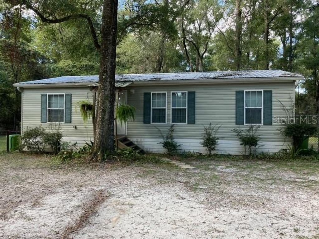 Photo of 267 SE Seawolf Way, High Springs, FL 32643 (MLS # A4669013)