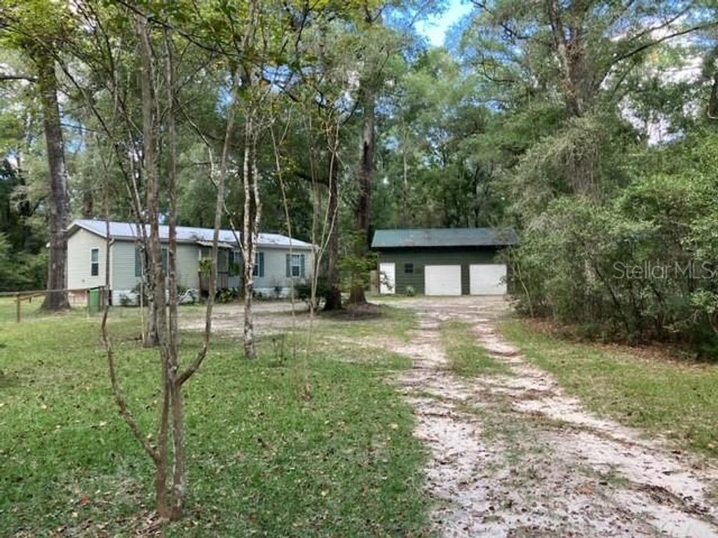 Photo of 267 SE Seawolf Way, High Springs, FL 32643 (MLS # A4669013)