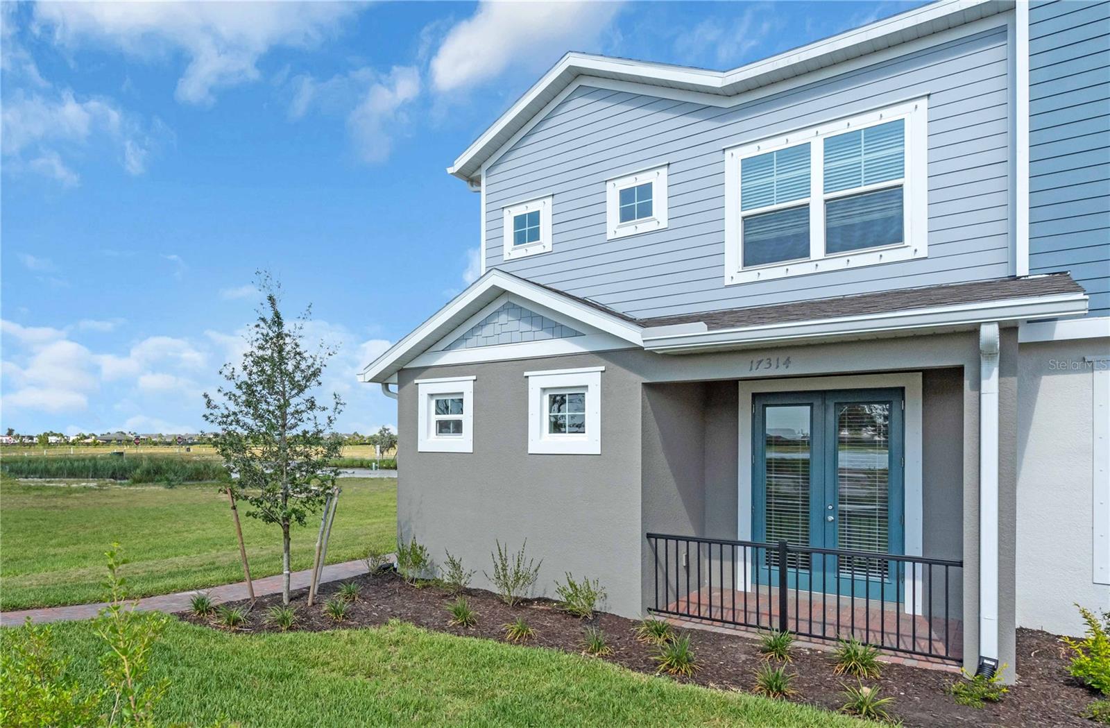 Under Construction. Discover the Adams, an ideal 4-bedroom, 3.5-bathroom rear entry garage townhome. As an end unit, it offers the convenience of a side entry. Enjoy a first-floor master suite featuring dual walk-in closets and French doors leading to a private front porch. The open concept design seamlessly connects the kitchen and gathering areas. Upstairs, guests are welcomed by an airy loft surrounded by two more bedrooms and a guest suite complete with its private bath. Experience the perfect blend of comfort and functionality in this thoughtfully designed townhome.