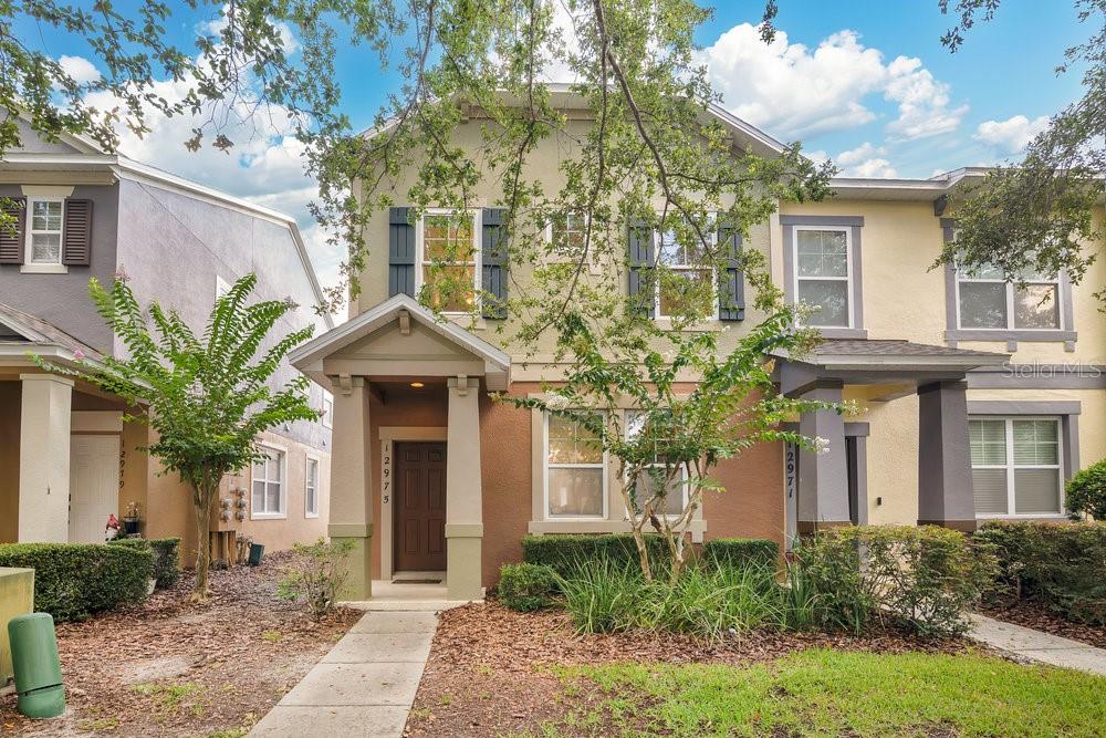 Welcome to this beautifully maintained 3-bedroom, 2.5-bath end-unit townhouse nestled in the highly sought-after Wickham Park community in Windermere. Boasting an ideal layout and thoughtful features throughout, this home is perfect for comfortable everyday living and easy entertaining.
Step inside to find tile flooring throughout the main level and plush carpeting upstairs. The spacious open-concept living and dining area is filled with natural light, creating a bright and airy atmosphere. The kitchen is equipped with granite countertops, a breakfast bar, a generous pantry, and recently updated appliances—making it both stylish and functional.
Upstairs, all three bedrooms offer privacy and comfort. The primary suite features a walk-in closet and a private en suite bath. The two additional bedrooms are connected by a convenient Jack-and-Jill bathroom. A laundry area is also located on the second floor for added convenience.
Enjoy your own private courtyard—ideal for relaxing evenings or entertaining guests—along with a detached two-car garage accessible via a rear alley. From the courtyard, take in nightly views of the Disney fireworks—a magical bonus!
Wickham Park offers a host of community amenities including a pool, clubhouse, and a brand-new park with dog runs located at the subdivision’s entrance. With top-rated schools nearby and just minutes from Winter Garden Village, shopping, dining, and entertainment are always within easy reach.
Don’t miss your chance to own this charming Windermere gem—schedule your showing today!