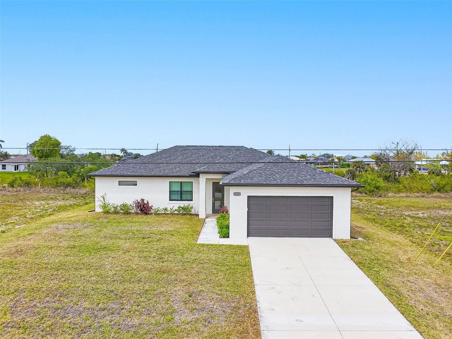 Welcome to your waterfront retreat in Cape Coral! Built in 2024, this beautifully designed 4-bedroom, 2-bath home offers 1,787 square feet of modern living space situated along the scenic Loch Ness Waterway—a freshwater canal with a concrete seawall.

Step inside to discover a bright, open-concept floor plan with tile flooring throughout, soaring ceilings, and a seamless flow between living, dining, and kitchen spaces—perfect for both everyday living and entertaining. The fully equipped kitchen features sleek cabinetry, stainless steel appliances, a spacious island with sink, and plenty of prep and storage space.

The split-bedroom layout provides privacy, with a private primary suite and secondary bedrooms ideal for family, guests, or a home office. 

Enjoy peace of mind with impact-resistant windows, and take advantage of the expansive backyard overlooking the tranquil canal—perfect for relaxing, fishing, kayaking, or creating your own outdoor oasis.

Located in a growing area of NW Cape Coral, this home offers easy access to some of the area’s best parks, recreation, and family-friendly attractions, including Sunsplash Family Waterpark, Joe Stonis Park, Burnt Store Boat Ramp, and miles of nearby walking and biking paths. Whether you enjoy boating, outdoor activities, or simply soaking in the Southwest Florida lifestyle, this location delivers.

New construction, waterfront living, and a vibrant outdoor lifestyle—this home truly has it all. Schedule your private showing today!