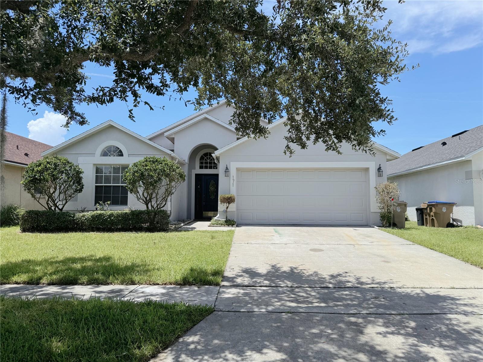 Move-in ready, this well-kept 4-bedroom, 2-bath home is located in the gated Remington Golf Community. Filled with natural light, the open layout features a spacious formal dining room and family room positioned beside the kitchen, perfect for both everyday living and entertaining. The tile flooring runs throughout the home, making it easy to maintain and clean. Step outside to unwind in the enclosed patio or host gatherings in the private, fenced backyard. Ideally located just minutes from the Florida Turnpike, with convenient access to theme parks, shopping, dining, and scenic East Lake Toho.