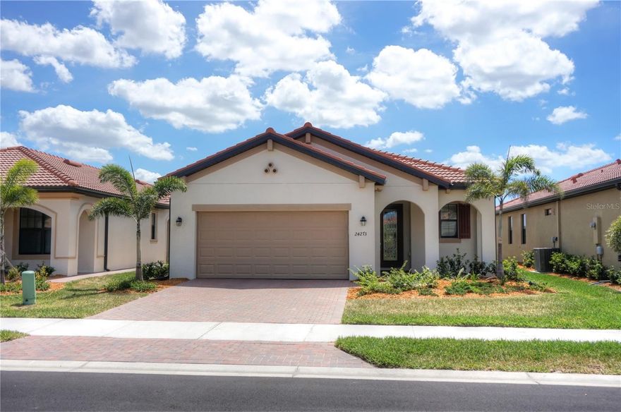 This home just built in 2022 and now available for quick move in. The popular MILAN floor plan 2BD/2BA/DEN/2CG with LAKE AND GREENSCAPE VIEWS, NO HOUSES BEHIND YOU!!! PLENTY OF ROOM TO ADD YOUR OWN PRIVATE POOL!! Open floor plan with tons of windows and light- bright and sunny with SOUTHWEST exposure. That means spectacular SUNSET VIEWS! Covered lanai to sit and watch the Florida wildlife. Plenty of room to add a pool. Property is being offered TURNKEY! TWO FULL GOLF MEMBERSHIPS COME WITH THIS HOME!! Open floor plan with rectangular tile flooring throughout main areas and carpet in the bedrooms. Crown molding in main areas. Spectacular kitchen with granite counters, stainless steel appliances, back splash, upgraded raised panel cabinets, Island with counter height seating. Separate Den area, formal living room space, or whatever your needs might be. Separate dining area for more formal gatherings, family gatherings, or game night. Master bedroom with en suite bath overlooks spectacular view. Master bath offers dual sinks and large walk in shower, walk in closet. Guest bedroom and bath at other end of home for privacy Sarasota National is a marvelous community with over 1300 acres designated for preservation, conservation, lakes, and open space with amazing views, Proclaimed as an Audubon International Certified Sanctuary, making it the most gorgeous and enjoyable golf course to play at in the area. Offering resort style amenities with huge resort style pool and spa,Tiki Bar to serve refreshing drinks and a bite of lunch, tennis courts, pickle ball, Bocce courts, coffee lounge/library/card room/meeting place, 7000 sq ft fitness facilities offering classes and day spa, and a 30,000 sq ft Clubhouse with dining and spectacular views. 18 Hole championship golf course surrounded by native wetlands and preserves provides an exhilarating and dramatic back drop for your golfing adventure. Minutes away from the new Wellen Park shopping area and Atlanta Braves stadium. Venice Beach and Venice Downtown are just a short drive. Your choice of restaurants and outdoor activities await. Come find YOUR Florida lifestyle TODAY and Live everyday like your on vacation! 3D WALK THROUGH AT : https://my.matterport.com/show/?m=GGFBdSjqed9