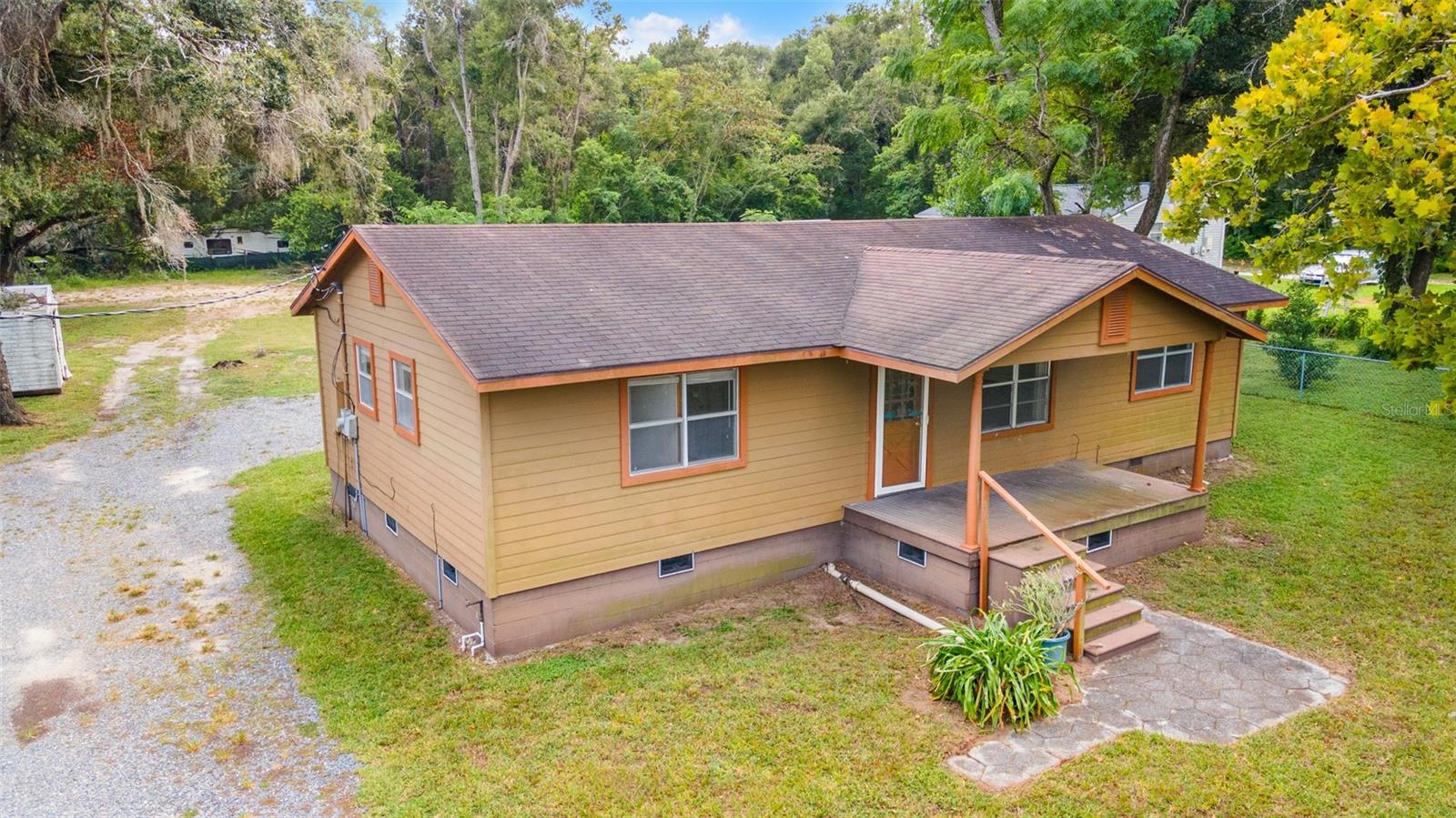 Country Living at Its Best!
Welcome to this spacious 3-bedroom, 2-bath home on nearly one acre in charming Dade City. Recently refreshed inside and out, this home offers easy-care tile in the bathrooms, cozy carpet and durable laminate in the main living areas, ceiling fans throughout, and charming wainscoting accents in the living room. This home also has a bonus room that can be used for an office, den, etc.
Relax with your morning coffee on the inviting front porch or spend evenings in the peaceful backyard with a covered porch and large metal storage building. The oversized lot is a rare find, providing endless opportunities—create an outdoor entertaining space, start a garden, add a workshop, or simply enjoy room for pets and play.
Nestled in a quiet setting just minutes from town, this move-in ready home combines the serenity of country living with the convenience of nearby shopping, dining, and schools. Priced to sell—don’t miss this affordable opportunity!