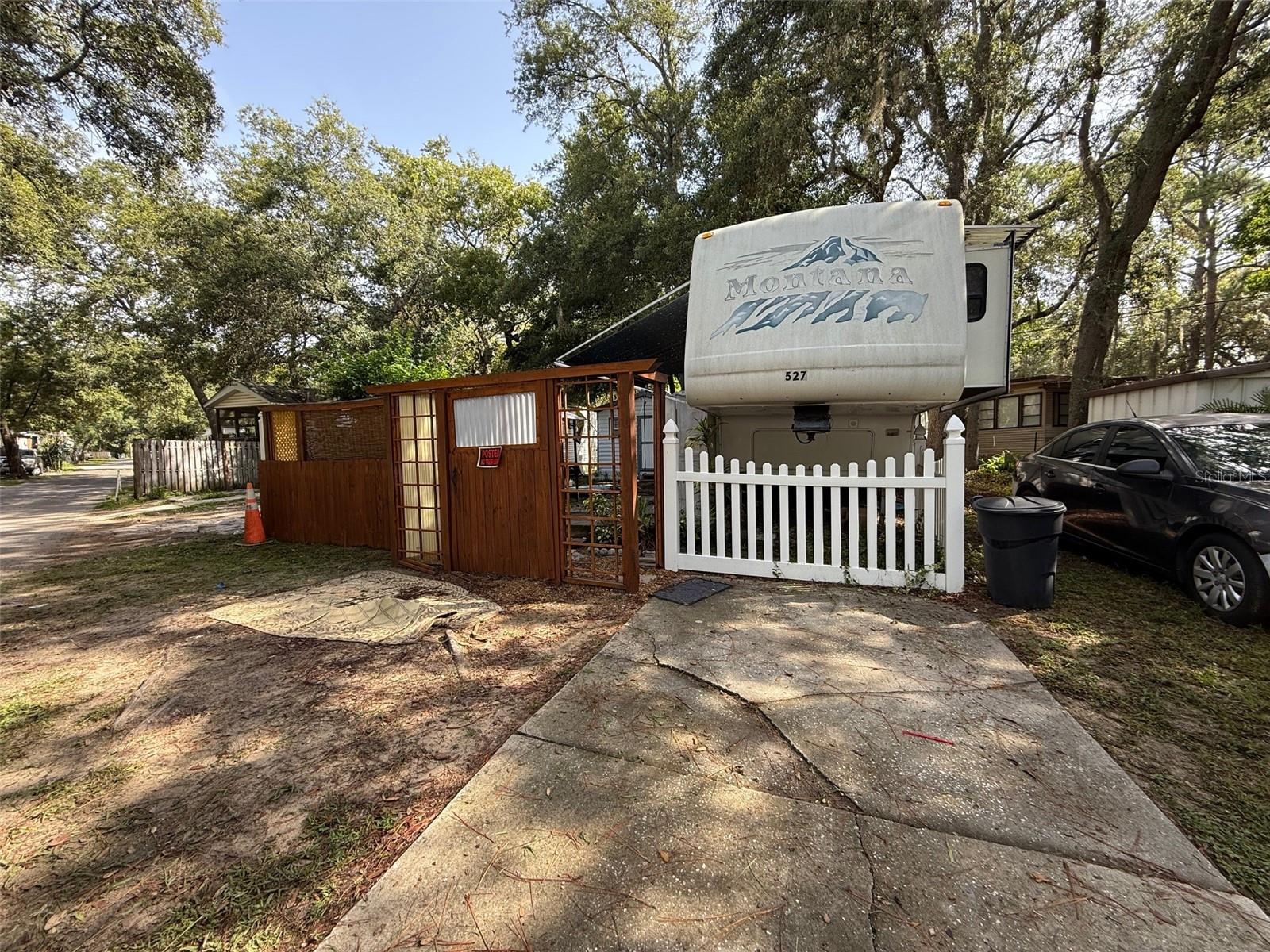 1 bedroom 1 bathroom trailer in a gated RV park. Fenced lot with concrete pad for sitting and a utility shed for extra storage. Size is perfect for one or two occupants. Partially furnished, includes Wi-Fi, No Pets. Located near West Orange trail and close to bus route, shopping, hospital, 30 minutes from Disney. Rent includes water, sewer, garbage pick-up, gated community with virtual guard, swimming pool, basketball, shuffleboard, mini-golf and much more.