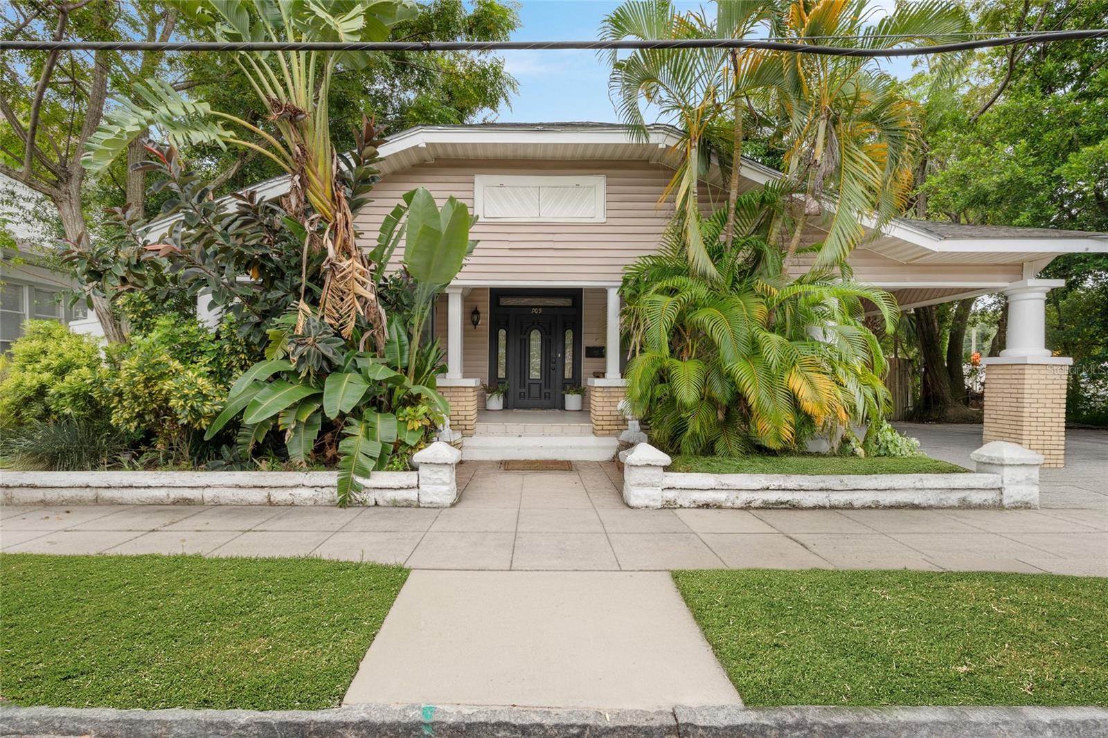 A historic bungalow. Located between the Ybor & Seminole Heights, Tampa area.
Features & Highlights
• Bungalow-style home
• Updates & Charm:
• Updated kitchen with granite countertops, stainless-steel appliances, and a professional gas chef’s stove
• Wood-burning fireplace in the dining room, additional fireplace in an upstairs bedroom
• Bathrooms are modernized, and there’s a new gas water heater
• Additional Structures:
• A 2-bed/1-bath carriage house in the backyard—great for rentals or guests
• A large workshop with running water and electricity