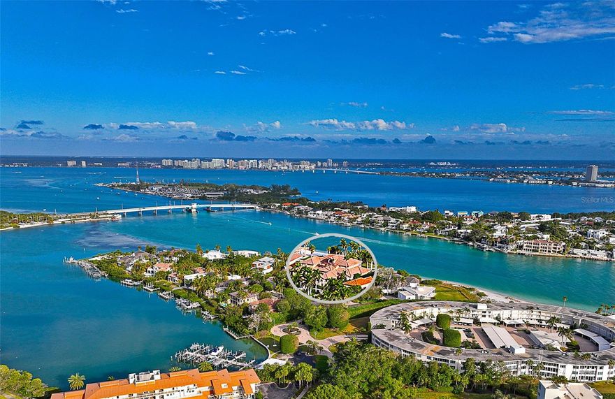 A PVT BEACHFRONT HOME W/ A PROTECTED DEEP-WATER DOCK! This remarkable res. is nestled on just over 3qtrs of an acre along the inlet of New Pass, where the Gulf of Mexico flows into the waters of SRQ Bay. Over 7,000SF of grandeur & sophistication exudes an exclusive luxurious lifestyle w/ a LBK address. The spacious 2-story interior boasts a main flr primary suite & study, plus a secondary suite upstairs along w/ 2 more full bed/ba en-suites. An elevator accesses the ground flr 3+CG all the way to the upper-level. Lavishly appointed w/ fine fixt. & finishes including polished stone, architectural elements, handcrafted woodworking, detailed clgs, granite, built-ins, dramatic lighting, furn. quality cabinets, 3 gas fp’s, & clg to flr glass showcasing sensational views. A Butler’s Pantry, a beverage ctr & 1 of 2 wet bars complement a gourmet kitch. w/ a bkfst bar. Top-of-the-line appls. incorporate a gas cooktop w/ an ornate range hood, dbl ovens, a warming drawer, a Sub-Zero fridge, & a DW. A 2nd DW can be found in the nearby lndry rm (there is also a W/D closet on the 2nd flr). 2 1st flr powder rms for guests. Waterside den/study adjacent to the primary Br on the first flr. Beyond dbl doors, water vistas set the stage for the opulent Owner’s Retreat offering a built-in media ctr, a sitting area & expansive dbl doors opening out to the pool, spa & the sound of the waves. 2 individual Calif.-style walk-in closets can be found in the combined dbl ba.  Spa-like features include a Romanesque shower w/ multiple nozzles & a glass door, a sep., elevated jetted tub, a single vanity w/ dual sinks & a makeup table, plus another vanity w/ a 3rd sink, 2 lavatories, & a bidet. The 2nd-flr landing & catwalk present another lndry area & equipped wet bar, & a convenient full ba. The attached balcony elevates the views, overlooking the pvt beach at the water’s edge. Brick pavers surround the sparkling, heated pool, & spa. A covered lounge, a summer kitch. & a designated outdoor ba make this a year-round oasis that continues to your own white sand beach on New Pass. Soak up the sun & gaze at frolicking sea gulls, playful pelicans & dolphins sprinting w/ the boats as they make their way to & from the gulf. Or if you prefer, navigate your own vessel from a deeded boat slip just inside the 40-ft-deep basin at Lighthouse Point. Promising an enjoyable day traversing SRQ Bay or fishing the treasured deep waters of the Gulf of Mexico. Lighthouse Point is behind 3 gates; one has a 24/7 guard.  As part of this exclusive gated comm., w/ only 16 homes, resident activities also include a tennis court. If you are craving a larger social aperture, it is adjacent to the LBK Club. The Links on Longboat is a seaside course w/ an incredible golfing experience, accommodating any level of play. Memberships to this premier club are tailored to suit many types of interest; w/ a 2nd harborside golf course, tennis courts, restaurants & lounges, fitness ctr, & spa, as well as concierge services. Plus, the LBK Club Moorings (harborside), a full-service deep-water marina w/ affiliation options. Living on LBK commands an expectation of modern conveniences. W/ a myriad of shopping & dining all nearby. Because of its prestigious southernmost shore location on the key, both St. Armand’s Circle & Downtown SRQ, w/ its diverse cultural scene, are also a short drive. Room Feature: Linen Closet In Bath (Primary Bedroom 2).