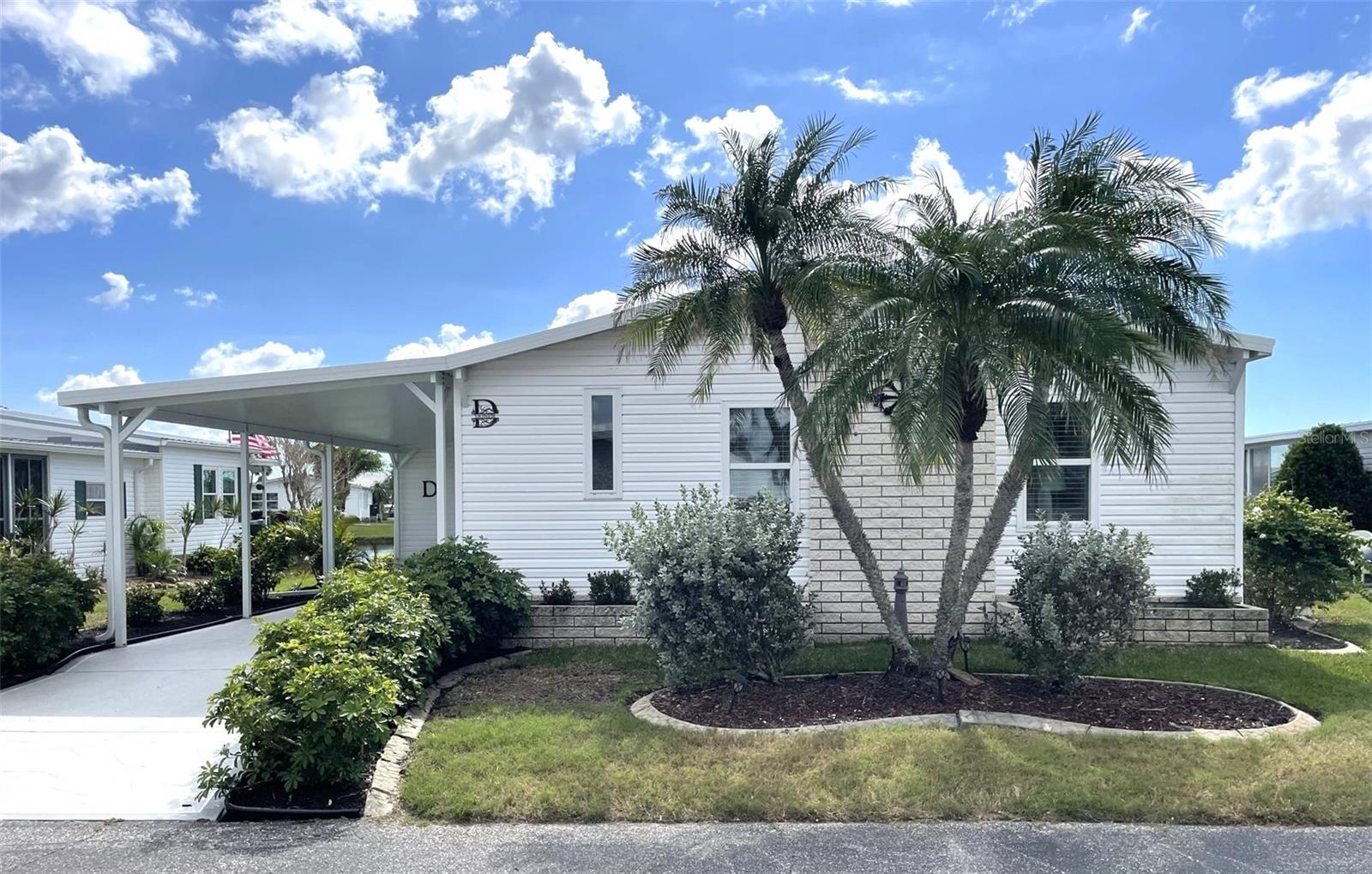 Welcome to this beautifully updated 2-bedroom, 2-bath manufactured home with breathtaking lake views, located in the highly desired community of Harbor Isles. This charming residence is a perfect blend of modern comfort and serene waterfront living.
Step into the remodeled kitchen featuring elegant granite countertops, a new refrigerator, a stunning mosaic tile backsplash, and a convenient pantry with pullouts, offering both style and functionality. Both bathrooms have been completely renovated, showcasing new vanities and exquisite tile walk-in showers. The home boasts vaulted ceilings and sleek laminate floors, creating an open and inviting atmosphere.
The true highlight of this property is the oversized, air-conditioned Florida room, where panoramic views of the lake provide the perfect backdrop for relaxation or entertaining guests. Step outside to a delightful patio overlooking the water – an ideal spot for enjoying your morning coffee or evening sunset.
This home offers peace of mind with its many recent upgrades, including a new carport, siding, roof, and AC in the Florida room (all in 2023). The central AC was replaced in 2010 and the motor is one year old. The hot water heater is just two years old, and the updated windows enhance energy efficiency. A whole-house water softener adds an extra touch of convenience, while the enlarged outside shed provides ample storage space.
Located in Harbor Isles, this vibrant, pet-friendly, land-owned 55+ community offers an active lifestyle with an array of resort-style amenities. Residents enjoy a heated pool and spa, fitness center, tennis courts, bocce ball, shuffleboard, and a clubhouse with a full calendar of social events. Outdoor enthusiasts will appreciate the scenic marina, kayak launch, and fishing opportunities. With its well-manicured landscaping and a welcoming atmosphere, Harbor Isles is a community where neighbors become friends.
Don’t miss this opportunity to own a beautifully updated home with stunning lake views in one of the most sought-after communities around. Schedule your showing today!