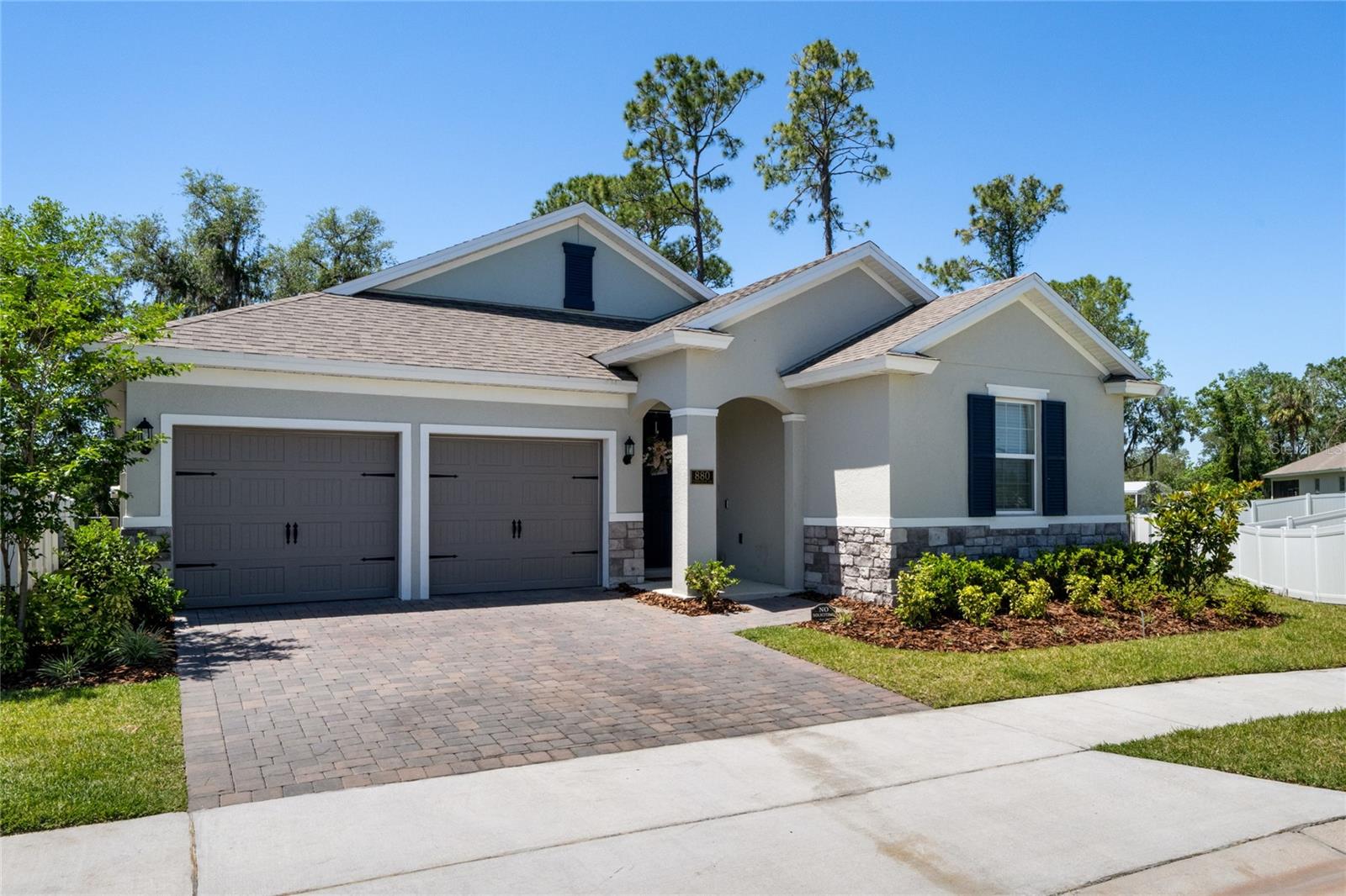 The Anna Maria model is a highly sought-after home with numerous upgrades and a spacious layout. This move-in ready, one-story home offers four bedrooms and three full baths, making it ideal for families or those who desire extra space. As you enter, you'll notice the upgraded wood-look tile that extends throughout the main living areas, creating a cohesive and elegant feel. The upgraded 5 ¼ baseboards add a touch of sophistication.
The exterior of the home boasts a pavered driveway and a beautiful homesite that provides ample privacy. Inside, the open floor plan allows for seamless entertaining and quality time with loved ones. The kitchen is a chef's dream, featuring stainless steel appliances, upgraded cabinetry, granite countertops, a designer backsplash, and an oversized kitchen island. It's a perfect space to prepare meals and gather with friends and family.
The owner's suite is a luxurious retreat, situated off the great room for added privacy. The en-suite bathroom exudes spa-like qualities with granite countertops, designer cabinetry, a rain head ceiling-mounted showerhead, designer tile in the walk-in shower, and a glass enclosure. The owner's suite also includes a large walk-in closet and a separate linen closet, providing ample storage space. Natural light fills the room through the custom bay window, offering a serene view of the private yard.
The three-way split floor plan ensures privacy for the secondary bedrooms, making it ideal for families or accommodating guests. The home is equipped with energy-efficient features, including low-E windows and sliding doors, a high-efficiency HVAC system, a hot water heater, and a programmable thermostat. These features contribute to lower utility expenses, making the home more affordable to maintain.
In addition to the impressive features of the home, a state-of-the-art Vivint Security system is included. Valued at $5,000, this system features window and door sensors, glass breakage sensors, app-driven control from a smartphone, multiple cameras, and a keyless and programmable entry system. Please note that there may be a monthly monitoring cost for the new buyer.
Rivington is a master-planned community spanning 296 acres, located near the St. Johns River, west of US 17/92, and south of Konomac Lake. The community offers easy access to I-4, the beaches, the Debary SunRail station (just a ¼ mile away), restaurants, and shopping.
If you're interested in this beautiful home, don't hesitate to schedule a private showing. It presents an excellent opportunity to own a stunning residence with upgraded features and a desirable location.