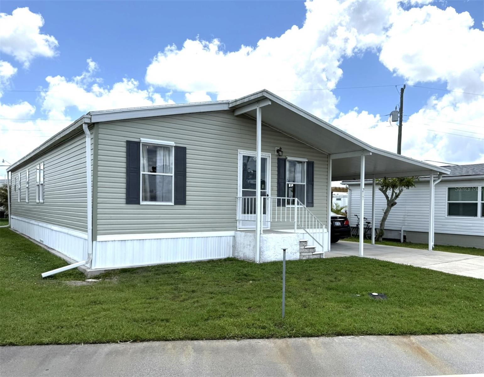 Welcome to this spacious 2005 two-bedroom, two bathroom manufactured home located in the desirable waterfront community of Harbor Cove. This well-maintained home offers a bright and open split bedroom floor plan with vaulted ceilings throughout. The large eat-in kitchen includes plenty of cabinet space and sliding glass doors that lead to a generous screened-in lanai, perfect for enjoying Florida’s beautiful weather.
The primary suite features two closets and an ensuite bath with dual sinks, providing both comfort and convenience. A charming foyer offers a flexible space that can easily be used as a den or sitting area. The laundry is located inside the home for added ease. Important updates include a new roof in 2022, AC in 2019, and a new hot water heater in 2022.
Harbor Cove is a well-established and welcoming 55+ waterfront community known for its active lifestyle and exceptional amenities. Located along the Myakka River with direct access to the Gulf of Mexico, it’s a haven for boating enthusiasts. Residents enjoy a private marina, boat ramp, heated pool and spa, fitness center, clubhouse with year-round activities, tennis, shuffleboard, and more. Whether you're looking to stay active or simply relax by the water, Harbor Cove offers the perfect setting to enjoy the Florida lifestyle.