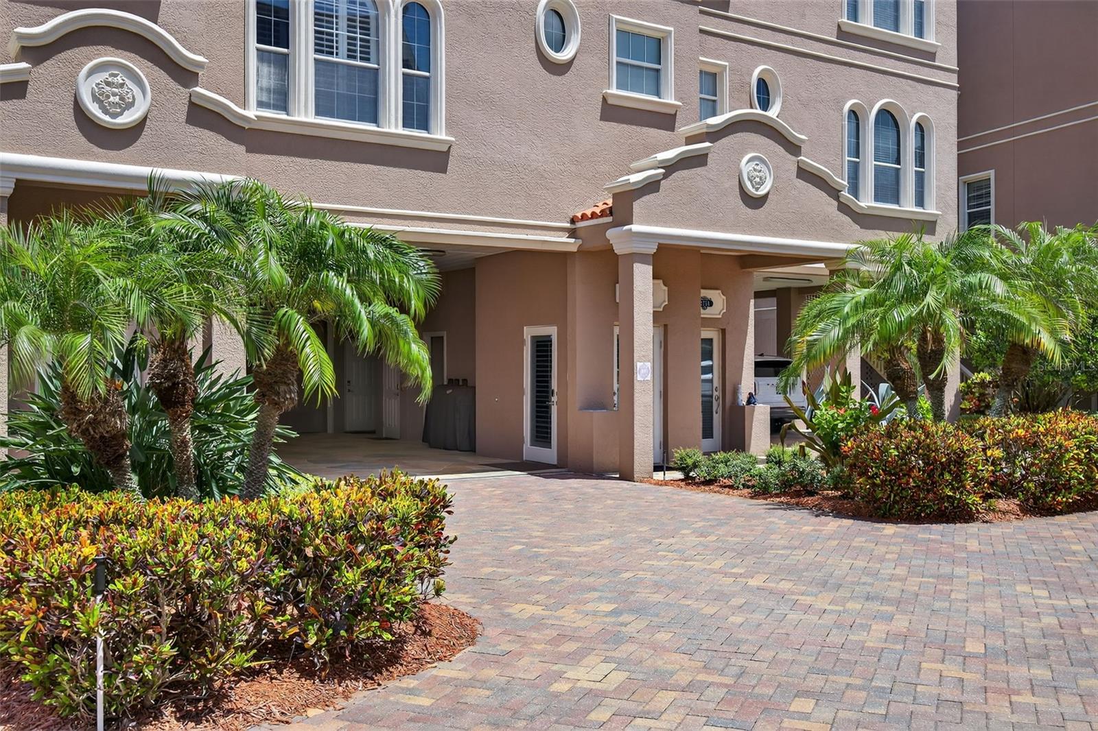 Luxurious Gulf Front Living Awaits in the Reserve at Mediterranean Manors here in the charming town of Dunedin. Tucked along the shores of the Gulf, this stunning four-bedroom, three-bath townhome offers unparalleled open-water views. From the moment you enter, every detail has been thoughtfully designed to capture the feeling of living on a year-round vacation. Spanning four meticulously planned levels with private elevator access to each floor, this home features a show-stopping 58x24 rooftop deck. The chef’s kitchen is a showstopper appointed with rich, custom wood cabinetry with crown molding, gleaming granite countertops, upgraded stainless steel appliances, a walk-in pantry, and a charming breakfast nook overlooking the Gulf’s open waters. The great room is the heart of the home, where nearly 10-foot ceilings, crown molding, custom built-ins, and a cozy gas fireplace frame an ever-changing backdrop of breathtaking sunsets. A flexible secondary bedroom and bonus living area on the main floor adds versatility. Upstairs, the private owner’s retreat feels like a five-star suite, complete with French doors leading to a covered, screened balcony and captivating Gulf views. Two oversized walk-in closets provide ample storage, while the spa-like ensuite bath offers maple cabinetry with granite countertops, dual vanities, a jetted Jacuzzi tub, and a custom glass walk-in shower. Two additional bedrooms on this level feature generous layouts, stylish closet systems, and access to beautifully finished baths with granite and maple cabinetry. Take the elevator to the fourth level to discover an expansive 58x24 rooftop deck, where entertaining meets unforgettable sunsets over the Gulf. Whether you’re hosting under the stars or enjoying quiet moments of reflection, this space will take your breath away. The property also includes a 2-car garage plus a 4-car carport, providing plenty of space for guests or toys. Recent upgrades include a 2019 tankless hot water heater, dual high-efficiency A/C systems, a full-home water softener and filtration system, and more. Roof replacements are included in the HOA reserves, offering peace of mind for years to come. Nestled in the highly sought-after Reserve at Mediterranean Manors, residents enjoy resort-style amenities including a heated pool, tennis, bocce, and pickleball courts, a private community beach, kayak launch, small boat mooring area, gym, and two recreational facilities. Perfectly situated just minutes from the Pinellas Trail, top-rated golf courses, award-winning beaches like Honeymoon and Caladesi Island, and the vibrant towns of Palm Harbor and Dunedin. Only 30 minutes from Tampa International Airport, this is coastal living at its most refined. It’s more than a home—it’s your private slice of paradise.