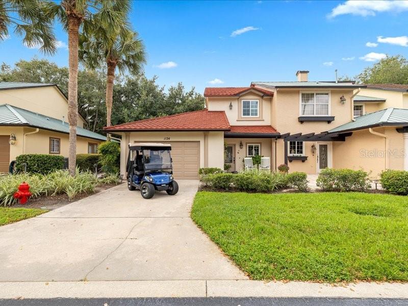 LIVE STEPS AWAY FROM SPANISH SPRINGS TOWN CENTER! NO BOND! This is a unique opportunity to own a professionally designed, turnkey townhome-style end unit with a Yamaha golf cart, just steps from the revitalized Spanish Springs Town Square. The Spanish/Mediterranean-inspired neighborhood puts you within a 5 minute walk of The Sharon Performing Arts Center, shops, restaurants, and nightly entertainment.
This 2-bedroom, 2.5-bath plus loft home offers over 1,700 sq. ft. of thoughtfully upgraded living space. The kitchen features bright white cabinetry with under- and in-cabinet lighting, granite countertops with a stylish backsplash, large sink, a gas stove, stainless steel appliances, and a spacious pantry with a custom frosted glass door and built-in shelving. The living and dining areas showcase rich hardwood flooring, bead board ceilings with crown molding, designer window cornices, custom vent covers, upscale furnishings, a convenient under-stair storage closet with frosted glass door, and a guest half-bath with granite counters and upgraded tile.
The main-level primary suite offers crown molding, a bead board ceiling, a custom-shelved walk-in closet, and a luxurious en-suite bath with dual sinks, an upgraded tiled shower, and a glass enclosure. Upstairs you’ll find a cozy loft with seating and TV, along with a second bedroom featuring a modern Murphy bed—perfect for guests or a home office—plus an adjacent full bath.
French doors open to a spacious private courtyard with ceramic pots and an outdoor storage container, creating a tranquil setting for relaxing or entertaining.
Additional upgrades include INDOOR LAUNDRY, new windows (2025), Grabber blinds, built-in surround sound, a mini-split A/C and granite work bench in the garage, fresh exterior paint (2024), a new clay tile ROOF (2024), new HVAC (2025), and a new HOT WATER HEATER (2024). The garage accommodates one car plus a golf cart.
The HOA makes maintenance worry-free by covering the cost of roof, exterior, driveway, landscaping, irrigation, pest control, exterior insurance, lawn, sprinkler system, and more. If you’re looking for style, comfort, convenience and an unbeatable location in the heart of The Villages—this is the one!