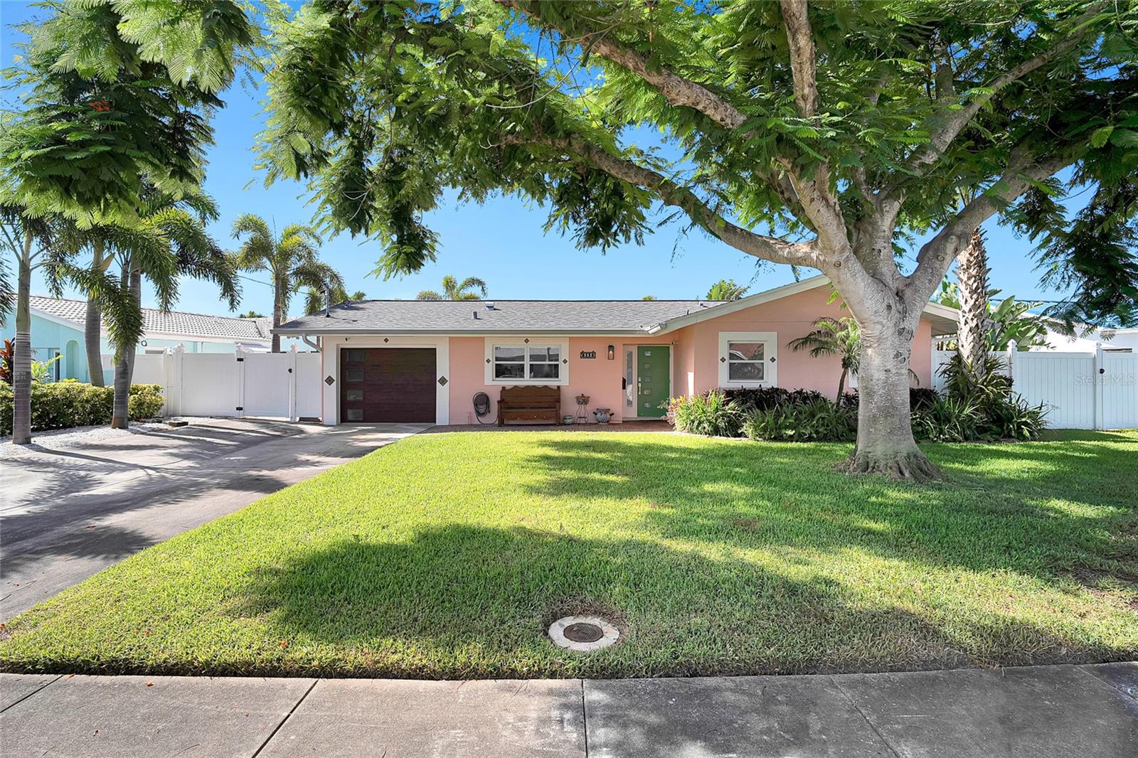 Welcome to your thoughtfully upgraded waterfront retreat in the highly desirable Coquina Key neighborhood - just minutes from vibrant downtown St. Pete. This one-of-a-kind home blends modern luxury, eco-conscious living, and effortless Florida charm. Nestled on a deep water canal, enjoy direct access to the open bay from your private dock complete with a boat lift, perfect for sunset cruises, weekend outings, or spontaneous adventures. Whether you’re boating, paddleboarding, or simply unwinding dockside with a glass of wine, the serene water views and golden-hour sunsets make every evening feel like a getaway. This home is as efficient as it is beautiful. A nearly 11 kW Tesla solar panel system, paired with two Tesla Powerwalls (all under warranty), allows the entire home to run fully off-grid. Through
the Tesla app, you can easily monitor energy usage, adjust reserves, and optimize performance for peace of mind and sustainable living. A 50-amp RV hookup by the garage adds further convenience and functionality. Step inside to discover refined interiors, featuring custom cabinetry by Londos Fine Cabinetry throughout the kitchen, bathrooms, and laundry room. The open-concept layout flows seamlessly to the outdoor living areas, where a completely updated pool system, including new automation, heater, filter, pump, salt cell, and blower - makes year-round enjoyment effortless. The roof was replaced in December 2024, offering added value and long-term durability. The
seawall, installed in 2013, was designed for strength and longevity, ensuring your waterfront investment remains protected for years to come. The spacious backyard offers a front-row seat to St. Pete’s iconic sunsets, an ideal setting for al fresco dining, entertaining, or simply relaxing by the water. Enjoy quiet mornings with coffee on the dock or peaceful evenings watching the sky glow as the day winds down. Included with the sale are custom architectural plans to expand the home, allowing for a future master suite with ensuite bath, covered carport, extended front entry, and a central outdoor kitchen and entertainment space connecting both wings of the home. This is a rare opportunity to own a thoughtfully designed, energy-efficient waterfront property in Coquina Key, perfectly positioned for those seeking a laid-back yet luxurious Florida lifestyle, with room to grow and features that truly set it apart. This home did not flood or loose power during hurricane Milton or Helene.