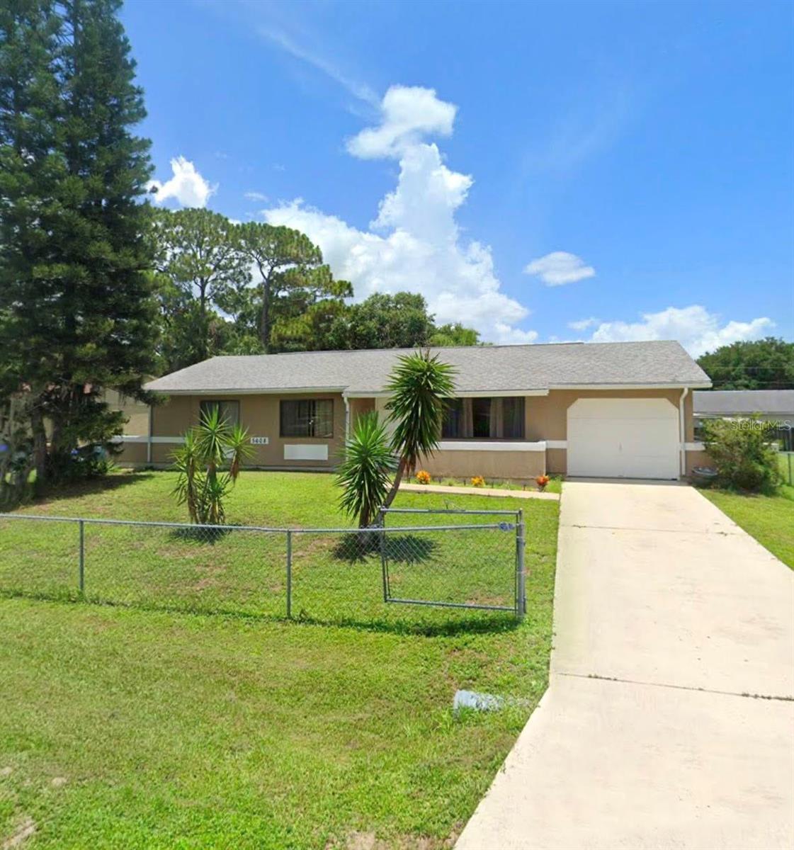 Step into easy living with this charming 3-bedroom, 2-bathroom home, complete with a 1-car garage and fenced yard, this home is packed with great features! Located in one of the most sought-after areas, this home is just a short walk to Coco Plum Shoppe’s, Hobby Lobby, Publix and some of the area’s best local restaurants. With city water and everything close by—including Blue Ridge Park with its kayak launch, picnic pavilion, and playground—you’ll love where you live. As you walk through the front door, you’ll find a clean and modern space with ceramic tile flooring throughout the entire home—easy to maintain and perfect for any style. The spacious kitchen is a true highlight, featuring granite countertops, rich wood cabinetry, and a large breakfast bar that’s perfect for casual meals or chatting with friends while cooking. There's plenty of counter space and storage, so everything has a place. Right off the kitchen is a formal dining room with a sliding door that opens to a screened, covered lanai—ideal for relaxing mornings or quiet evenings outdoors. There is a laundry area off the hallway with full size washer & dryer. The layout of the home is both open and functional, giving you room to spread out and enjoy each space. Both bathrooms are updated with newer vanities and countertops that add a fresh, polished look. The interior and exterior of the home have been recently painted, so it’s truly move-in ready. The inside laundry room adds an extra touch of convenience, keeping chores tucked away and easy to manage. Outside, the fully fenced yard offers privacy and space to enjoy the outdoors. Whether you're gardening, grilling, or just soaking up the sun, this yard gives you the freedom to make it your own.
Don't miss this great opportunity to live in a well-cared-for home in a top location—come see it today!