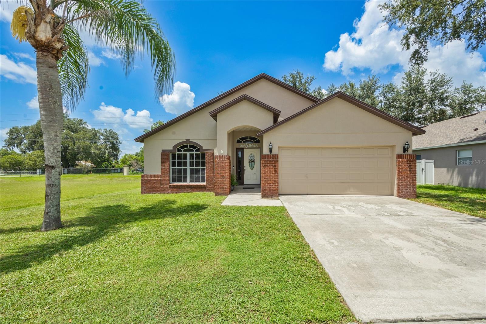 Charming Corner-Lot Cottage in the Heart of Plant City. Step into this fully refreshed farmhouse-style retreat featuring three beatufiul bedrooms, two spacious bathrooms, and a bright, breezy open floor plan perfect for gatherings and everyday living. The Jack and Jill bathroom creates convenient connectivity while maintaining privacy. Built in 2005 and boasting a brilliant blend of rustic charm and modern upgrades, this home has been throughfully transformed from top to bottom. The kitchen is a culinary dream with sleek stainless steel appliances, gorgeous granite-style countertops, and cozy custom brickwork that sets the tone for timeless taste. Set on a prime corner lot in picturesque Plant City-Florida's famous strawberry capital-this home primises sweet Southern living. A brand-new roof will be installed before closing, providing peace of mind and polished curb appeal. Don't miss this stylish, stunning, and story-perfect space ready to welcome its next lucky owners!