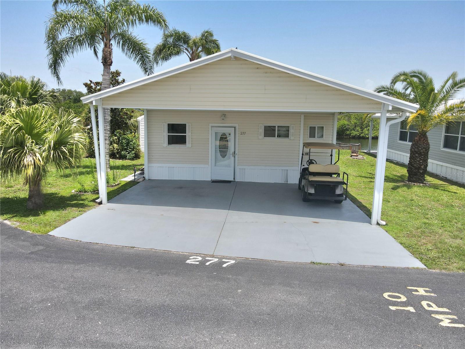 ~BLUE CYPRESS GOLF & RV RESORT~
Discover tranquil waterfront living at Blue Cypress Golf and RV Resort. This newly renovated one-bedroom, one-bathroom home offers a spacious 1,670 square feet of comfortable living space. Situated on a premium corner lot with extra space, this charming retreat features a serene patio with peaceful water views.
Step inside to find a generously sized living room and a fully furnished interior that's move-in ready. All major appliances are included—even washer and dryer—so you can start enjoying resort living immediately.
The community amenities are nothing short of impressive: enjoy rounds at the golf course, challenge friends to pickleball, take refreshing dips in the swimming pool, or try your hand at shuffleboard. Your private dock provides direct water access for fishing enthusiasts and nature lovers.
The clubhouse serves as the social hub for community gatherings, while abundant recreational opportunities await around every corner. This little slice of Florida paradise offers the perfect balance of relaxation and activity—your vacation lifestyle awaits!
All measurments are approximate.