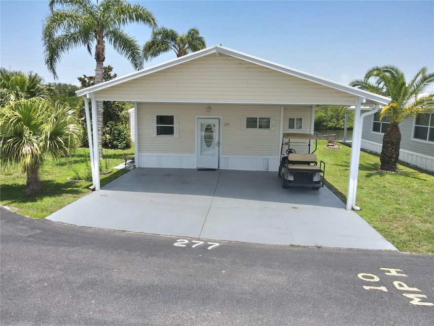 ~BLUE CYPRESS GOLF & RV RESORT~
Discover tranquil waterfront living at Blue Cypress Golf and RV Resort. This newly renovated one-bedroom, one-bathroom home offers a spacious 1,670 square feet of comfortable living space. Situated on a premium corner lot with extra space, this charming retreat features a serene patio with peaceful water views.

Step inside to find a generously sized living room and a fully furnished interior that's move-in ready. All major appliances are included—even washer and dryer—so you can start enjoying resort living immediately.

The community amenities are nothing short of impressive: enjoy rounds at the golf course, challenge friends to pickleball, take refreshing dips in the swimming pool, or try your hand at shuffleboard. Your private dock provides direct water access for fishing enthusiasts and nature lovers.

The clubhouse serves as the social hub for community gatherings, while abundant recreational opportunities await around every corner. This little slice of Florida paradise offers the perfect balance of relaxation and activity—your vacation lifestyle awaits!
All measurments are approximate.