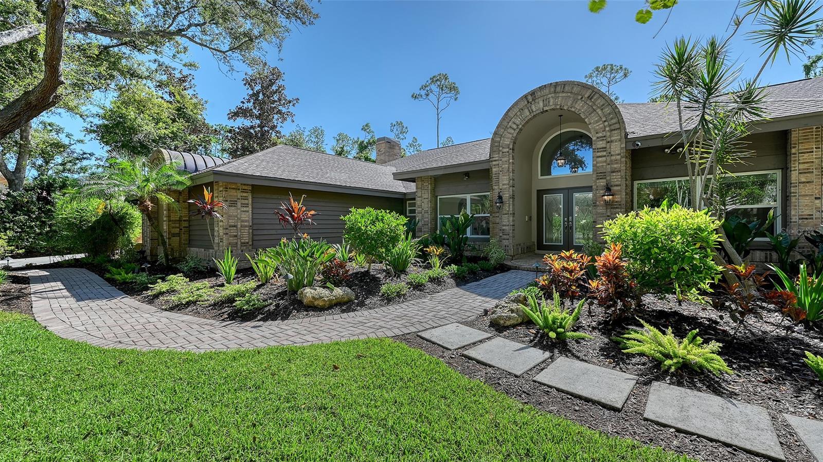 HUGE PRICE REDUCTION ON THIS HURRICANE-READY HAVEN! Luxury in the gated Woodlands II at Bent Tree! This meticulously updated 6-bedroom, 5-bathroom, 3-car garage estate with a dedicated office spans an impressive 5,027 square feet of living space (6,599 total). Nestled on a private ¾-acre cul-de-sac lot, the home is designed for families seeking unmatched security, style, and space in a storm-ready sanctuary. This masterpiece blends cutting-edge resilience with sophisticated elegance, offering a worry-free home in Sarasota’s premier community. CUTTING-EDGE HURRICANE PROTECTION AND RECENT UPGRADES: Built to withstand the fiercest storms, this home features hurricane-rated doors and windows, hurricane-rated garage doors, automatic hurricane shutters on the main lanai (added 2024), and a 2023 roof for unparalleled durability. A whisper-quiet 38kw water-cooled whole-house generator ensures uninterrupted power, while 4 modern AC units (2021-2023) deliver year-round comfort and efficiency. The pool cage, rescreened in 2024 with a tight weave, helps to block no-see-ums and enhances storm resistance. With freshly painted interiors, new irrigation nourishing lush tropical landscaping, and Flood Zone X status (no flood insurance required), this estate is as resilient as it is inviting. LUXURIOUS LIVING INSIDE AND OUT: Enter a world of elegance with 10-foot ceilings, soaring to 15 feet in the family room, where a wood-burning fireplace creates a warm ambiance. The 2020-remodeled chef’s kitchen dazzles with high-end cabinetry, granite countertops, a double oven and SubZero refrigerator, paired with a spacious mud room/pantry for ample storage. The lavish primary suite boasts vaulted ceilings, a spa-inspired bathroom, and dual walk-in closets, while four remodeled bathrooms (2020) showcase modern finishes. Top-tier vinyl plank wood flooring flows through main living areas, with plush carpet in two bedrooms and the family room for added comfort. RESORT-STYLE BACKYARD OASIS: The backyard is a private paradise, featuring a large, heated pool, expansive pavered deck, and two covered patios ideal for entertaining. Enjoy poolside meals with a gas grill, sink, and built-in storage, all framed by mature tropical landscaping and a fenced-in yard. An outdoor staircase connects upstairs bedrooms to the pool area for seamless access. SPACIOUS AND FUNCTIONAL DESIGN: Perfect for large families, this home offers four spacious downstairs bedrooms (one currently used as a bonus room), a generous office for remote work or study, a formal dining room, a living room, a gathering room, and two upstairs bedrooms sharing a full bathroom. The oversize 3-car side-load garage features hurricane-rated garage doors, Trex flooring, and extensive built-in organizers, complemented by a large courtyard for ample parking. PRIME LOCATION AND LIFESTYLE: Enjoy the 18-hole championship Bent Tree golf course with tree-lined fairways, expansive greens, and practice facilities. Stroll or bike along quiet, oak-lined roads, soaking in Florida’s idyllic weather. With no CDD fees, proximity to top-rated schools, Siesta and Lido beaches, St. Armands Circle, and downtown Sarasota’s vibrant dining and shopping, this estate delivers the best of Sarasota living. MOVE-IN READY AND STORM READY: With state-of-the-art hurricane protection, luxurious finishes, and recent upgrades, this Bent Tree estate is the ultimate blend of safety, sophistication, and serenity. Schedule your private tour today!