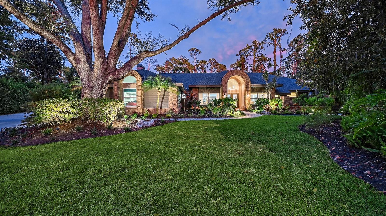 HURRICANE-READY HAVEN AND LUXURIOUS LIVING in the gated Woodlands II at Bent Tree! This meticulously updated 6-bedroom, 5-bathroom, 3-car garage estate with a dedicated office spans an impressive 5,027 square feet of living space (6,599 total). Nestled on a private ¾-acre cul-de-sac lot, the home is designed for families seeking unmatched security, style, and space in a storm-ready sanctuary. This masterpiece blends cutting-edge resilience with sophisticated elegance, offering a worry-free home in Sarasota’s premier community. CUTTING-EDGE HURRICANE PROTECTION AND RECENT UPGRADES: Built to withstand the fiercest storms, this home features hurricane-rated doors and windows, hurricane-rated garage doors, automatic hurricane shutters on the main lanai (added 2024), and a 2023 roof for unparalleled durability. A whisper-quiet 38kw water-cooled whole-house generator ensures uninterrupted power, while four modern AC units (2021-2023) deliver year-round comfort and efficiency. The pool cage, rescreened in 2024 with a tight weave, helps to block no-see-ums and enhances storm resistance. With freshly painted interiors, new irrigation nourishing lush tropical landscaping, and Flood Zone X status (no flood insurance required), this estate is as resilient as it is inviting. LUXURIOUS LIVING INSIDE AND OUT: Enter a world of elegance with 10-foot ceilings, soaring to 15 feet in the family room, where a wood-burning fireplace creates a warm ambiance. The 2020-remodeled chef’s kitchen dazzles with high-end cabinetry, granite countertops, a double oven and SubZero refrigerator, paired with a spacious mud room/pantry for ample storage. The lavish primary suite boasts vaulted ceilings, a spa-inspired bathroom, and dual walk-in closets, while four remodeled bathrooms (2020) showcase modern finishes. Top-tier vinyl plank wood flooring flows through main living areas, with plush carpet in two bedrooms and the family room for added comfort. RESORT-STYLE BACKYARD OASIS: The backyard is a private paradise, featuring a large, heated pool, expansive pavered deck, and two covered patios ideal for entertaining. Enjoy poolside meals with a gas grill, sink, and built-in storage, all framed by mature tropical landscaping and a fenced-in yard. An outdoor staircase connects upstairs bedrooms to the pool area for seamless access. SPACIOUS AND FUNCTIONAL DESIGN: Perfect for large families, this home offers four spacious downstairs bedrooms (one currently used as a bonus room), a generous office for remote work or study, a formal dining room, a living room, a gathering room, and two upstairs bedrooms sharing a full bathroom. The oversize 3-car side-load garage features hurricane-rated garage doors, Trex flooring, and extensive built-in organizers, complemented by a large courtyard for ample parking. PRIME LOCATION AND LIFESTYLE: Enjoy the 18-hole championship Bent Tree golf course with tree-lined fairways, expansive greens, and practice facilities. Stroll or bike along quiet, oak-lined roads, soaking in Florida’s idyllic weather. With no CDD fees, proximity to top-rated schools, Siesta and Lido beaches, St. Armands Circle, and downtown Sarasota’s vibrant dining and shopping, this estate delivers the best of Sarasota living. MOVE-IN READY AND STORM READY: With state-of-the-art hurricane protection, luxurious finishes, and recent upgrades, this Bent Tree estate is the ultimate blend of safety, sophistication, and serenity. Schedule your private tour today!