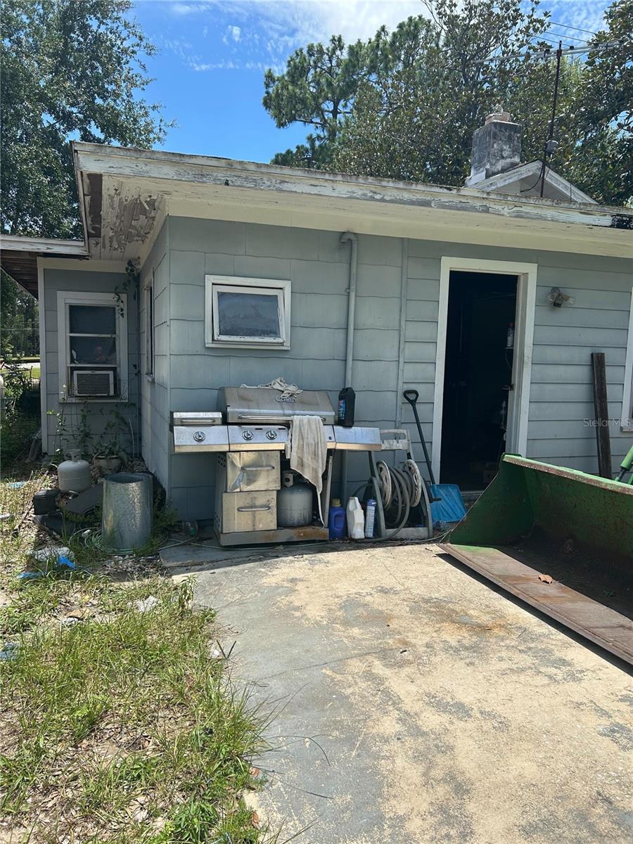 ***CALLING ALL INVESTORS*** Nestled on a generous corner lot just shy of a full acre, this charming Apopka home is a hidden gem brimming with potential and rustic charm. Built in 1954, this two-bedroom, one-bath concrete block residence offers the kind of character only time can create, perfectly paired with modern essentials and space to dream.
Step inside to discover nearly 950 square feet of living space, where tile and wood floors offer a warm welcome underfoot. The living room invites you to unwind with a cozy fireplace accented by a handsome stone surround—an ideal focal point for family gatherings or quiet evenings in. Adjacent, a classic Florida Room brings in beautiful natural light and adds flexibility as a den, sunroom, or creative space.
The heart of the home, the kitchen, is equipped with a range and refrigerator, offering a functional setup to craft your culinary favorites. From here, the home's intimate layout flows effortlessly into the two bedrooms, each located on the main floor. Though there are no built-in closets, this blank canvas offers an exciting opportunity to design personalized storage and wardrobe solutions.
For those drawn to outdoor living or needing room to expand, the property shines even brighter. With over 39,000 square feet of land, mature trees, and a wire fence enclosing the space, this oversized lot is ready for gardening, pets, or even adding additional structures. An existing workshop provides the perfect space for hobbies, storage, or a future renovation project. There’s also a one-car attached garage with laundry hookups, plus space to park a boat—truly a rare find.
The home is serviced by public water and sewer, and while it currently has no central air conditioning, its solid concrete construction and shaded surroundings help maintain natural cooling. The residence sits on a slab foundation beneath a shingle roof and is located in a flood zone X, offering peace of mind.
Whether you're looking for a project to restore and personalize or simply dreaming of a cozy homestead with land to grow, this fixer-upper has all the right bones. With its vintage charm, spacious lot, and unbeatable potential, it's a canvas ready for your vision.
This is more than just a house—it’s an opportunity to create the home and lifestyle you’ve been imagining. Come see for yourself what makes this property a standout choice for the creative homeowner or savvy investor.